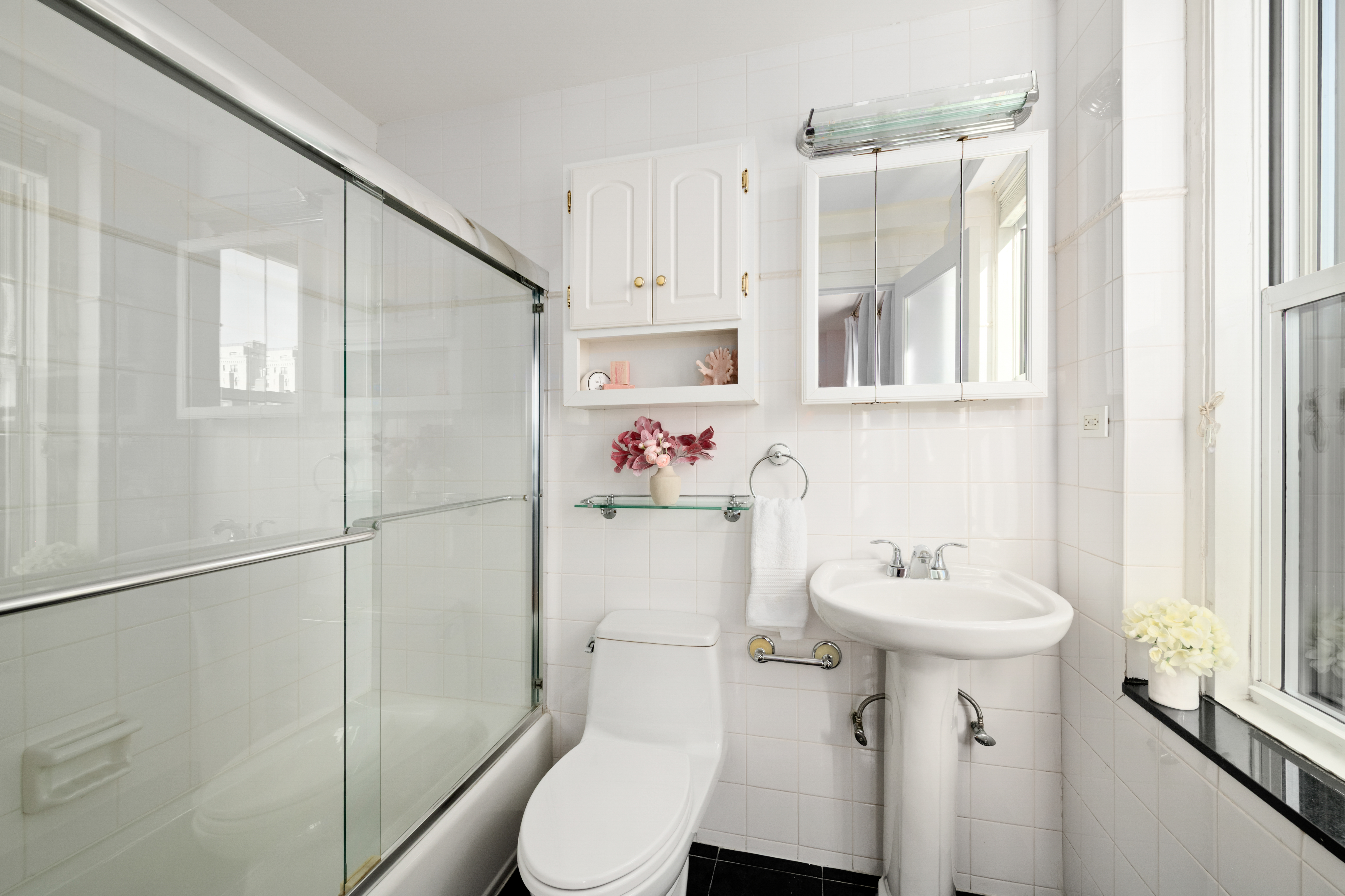 336 West End Avenue, Unit 7CD Manhattan, NY 10023 - Photo 12 of 16 a bathroom with a sink toilet and shower
