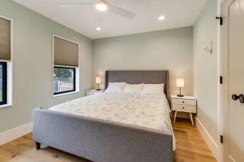 a bedroom with a bed and a rug