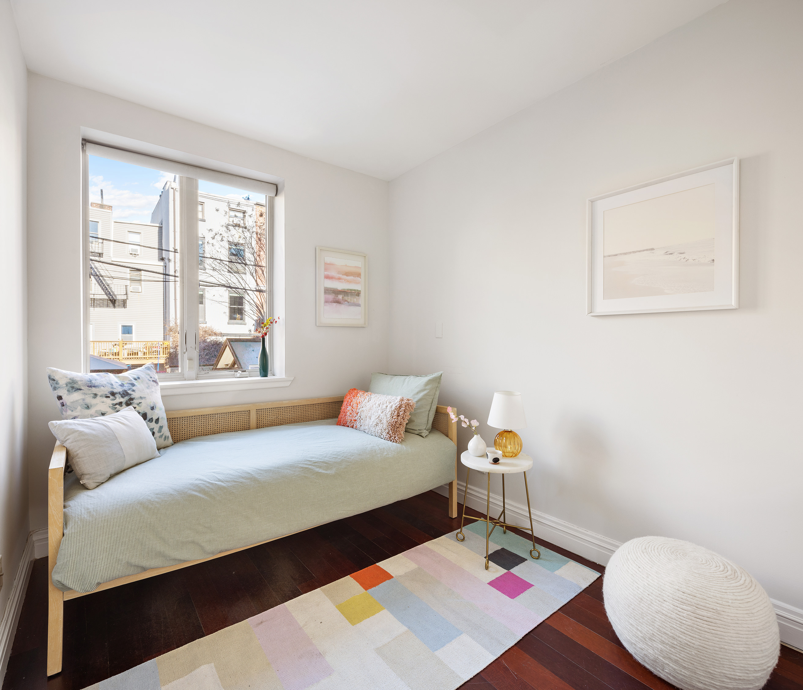 301 Warren Street, Unit 2 Brooklyn, NY 11201 - Photo 7 of 11 a bedroom with a bed and wooden floor