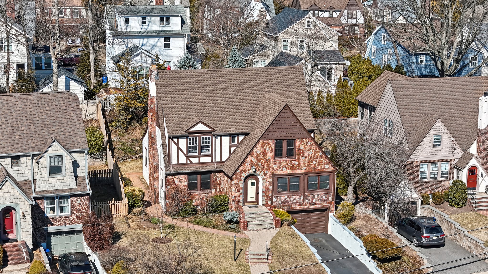 877 Ridgewood Road Millburn, NJ 07041 - Photo 34 of 37 a front view of a residential apartment building with a yard