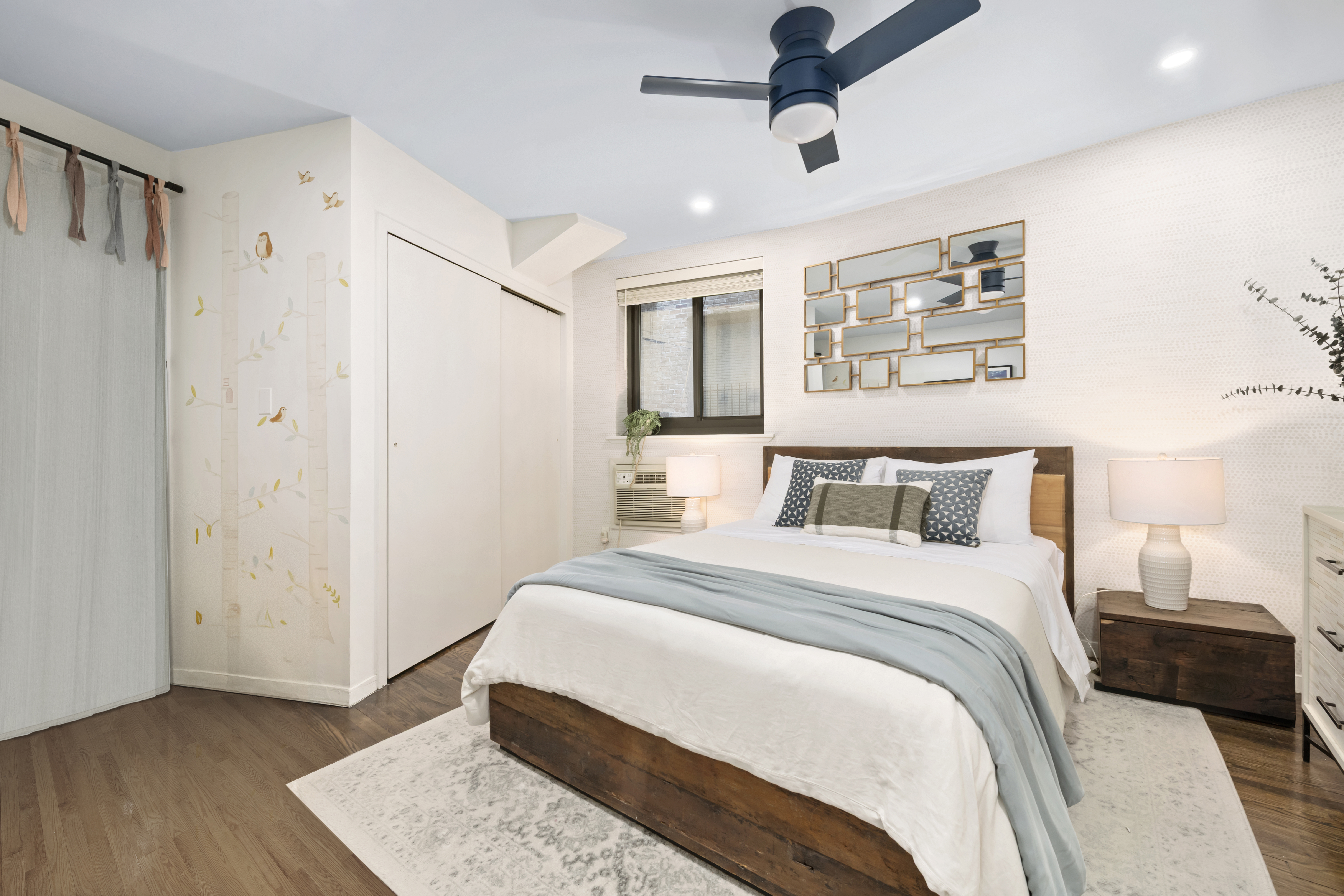 49 East 12th Street, Unit 4A Manhattan, NY 10003 - Photo 5 of 6 a bedroom with a large bed and a window