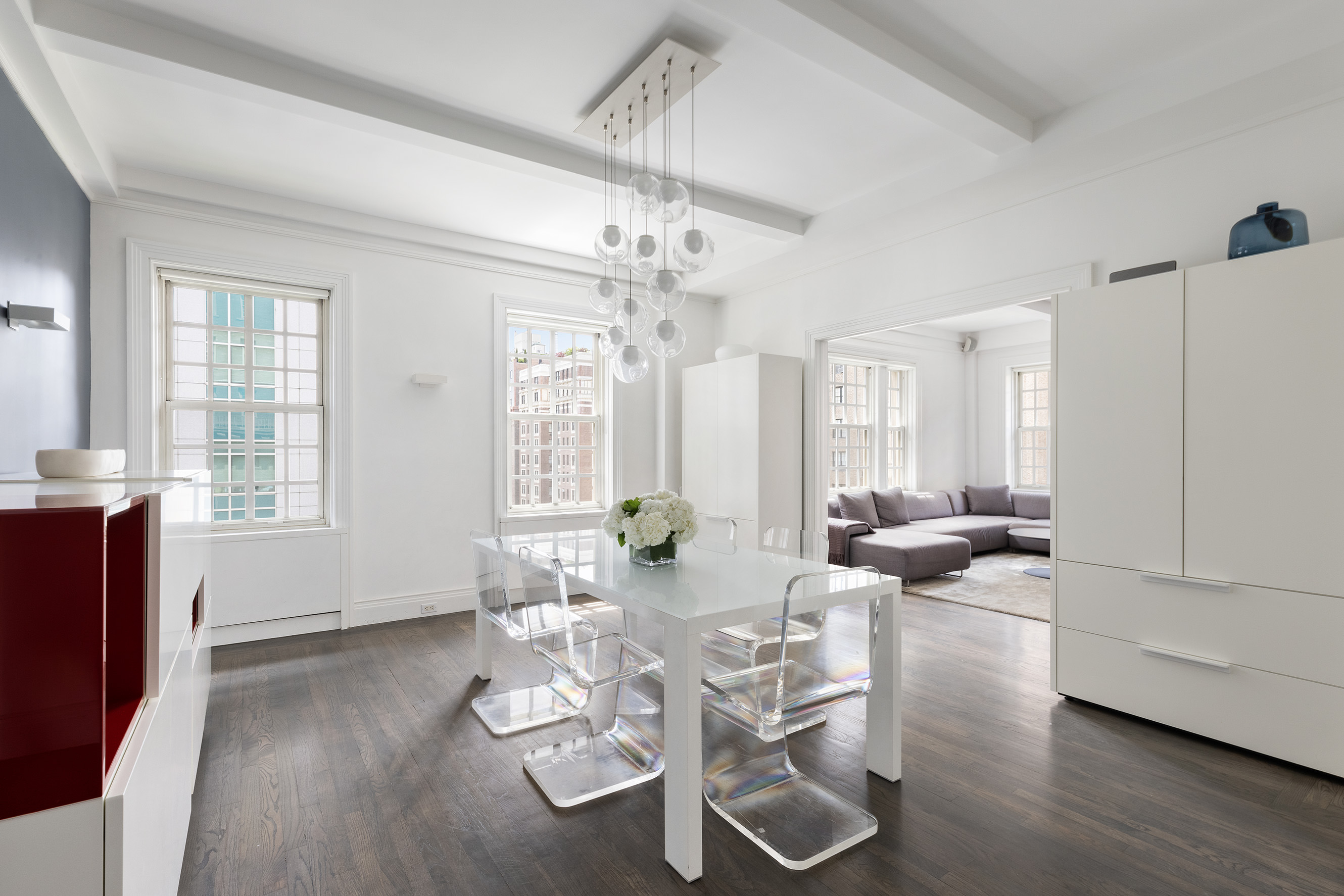 863 Park Avenue, Unit 8W Manhattan, NY 10075 - Photo 3 of 15 a living room with furniture or wooden floor and a chandelier