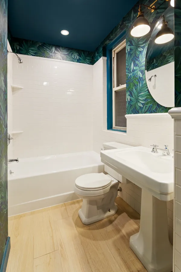 a bathroom with a toilet a sink and a bathtub