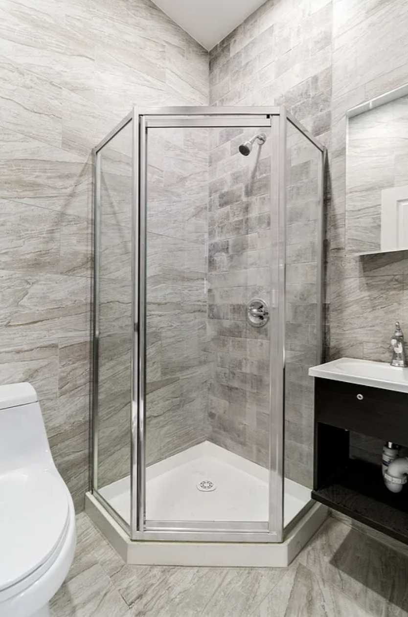 20 Suydam Street, Unit 1 Brooklyn, NY 11221 - Photo 6 of 10 a bathroom with a shower and toilet
