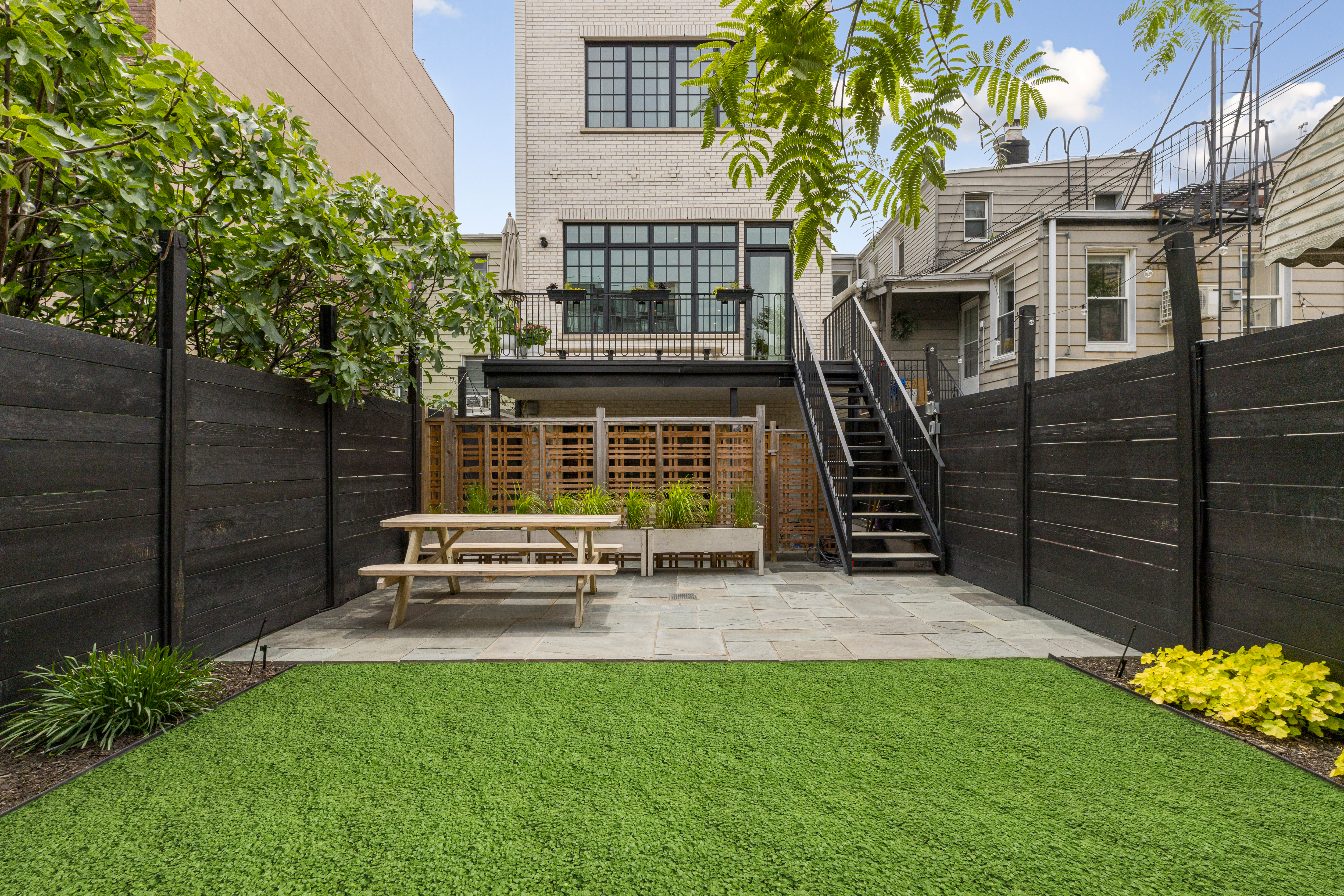 179 Devoe Street Brooklyn, NY 11211 - Photo 16 of 20 a view of a house with a yard