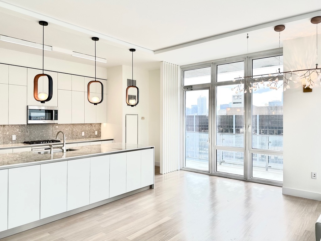 10 West End Avenue, Unit 30C Manhattan, NY 10023 - Photo 6 of 22 a very nice looking room with wooden floor and windows