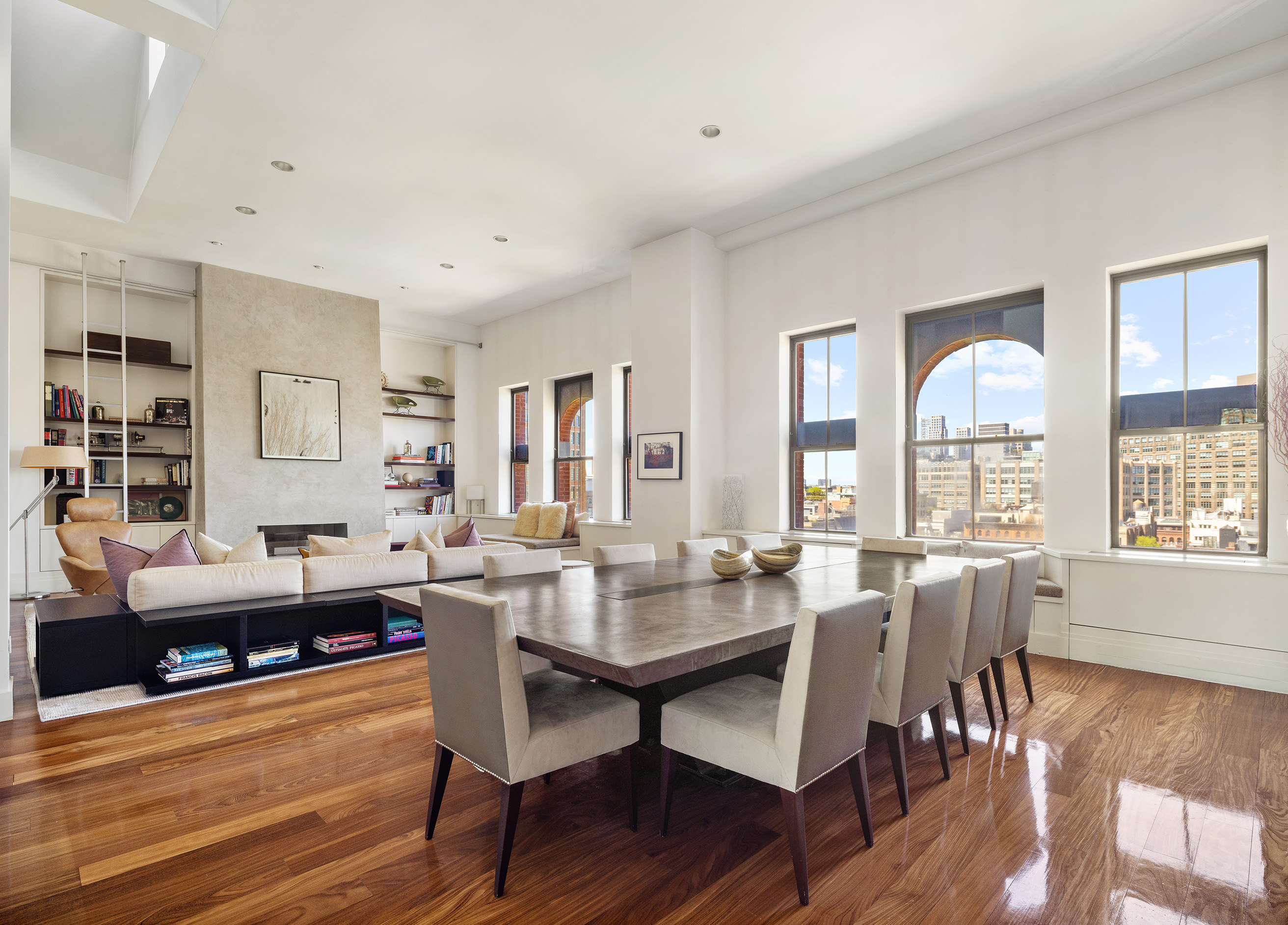 27 North Moore Street, Unit 10D Manhattan, NY 10013 - Photo 6 of 30 a view of a dining room with furniture and wooden floor