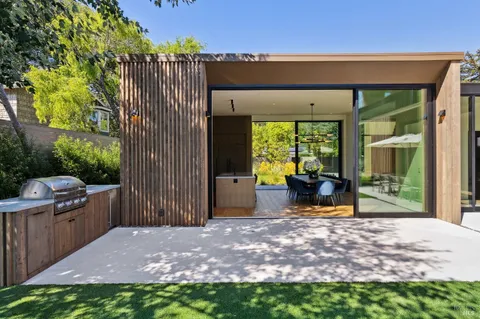 a view of a backyard with plants and garden