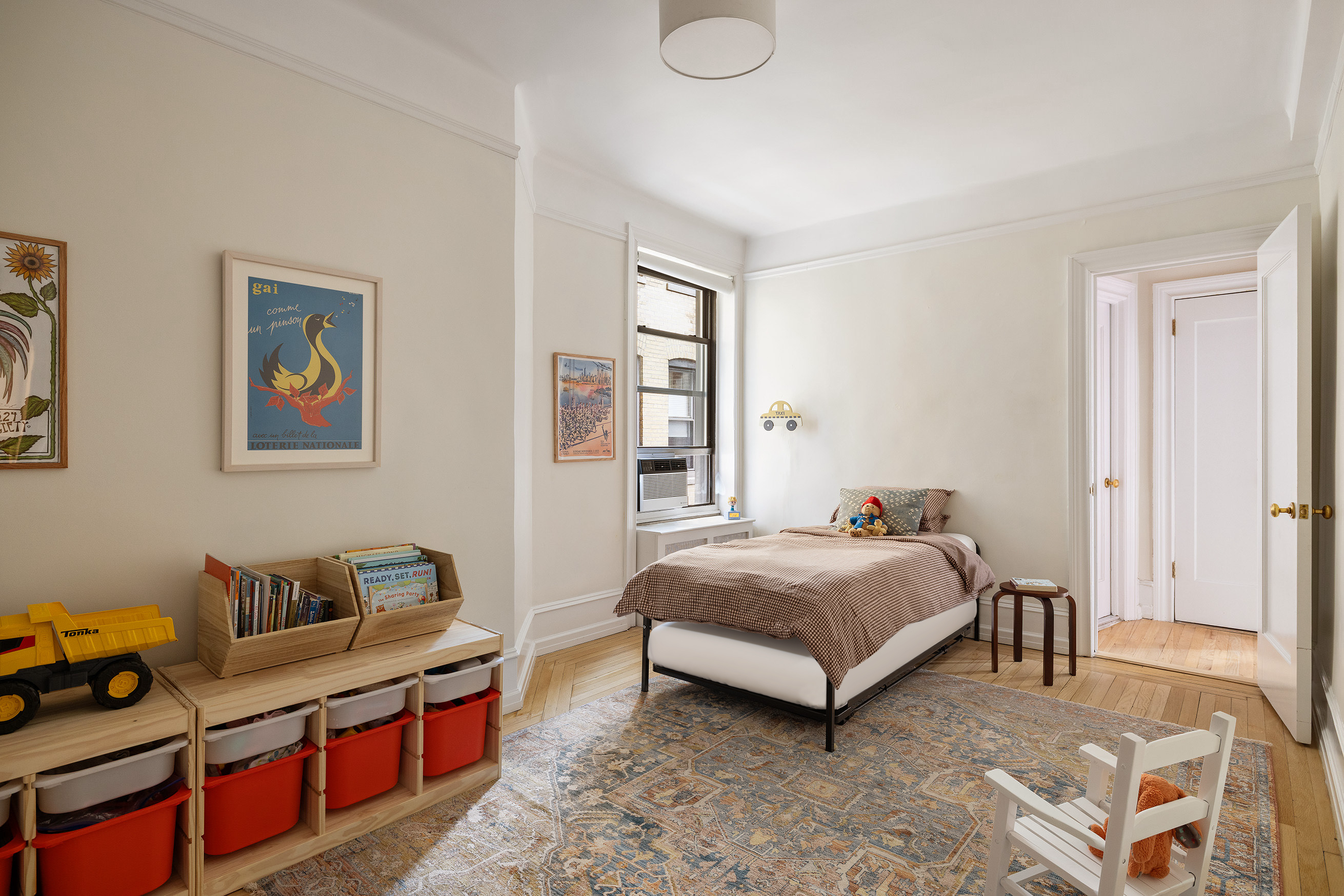 215 West 91st Street, Unit 77 Manhattan, NY 10024 - Photo 10 of 17 a bedroom with a bed and a couch