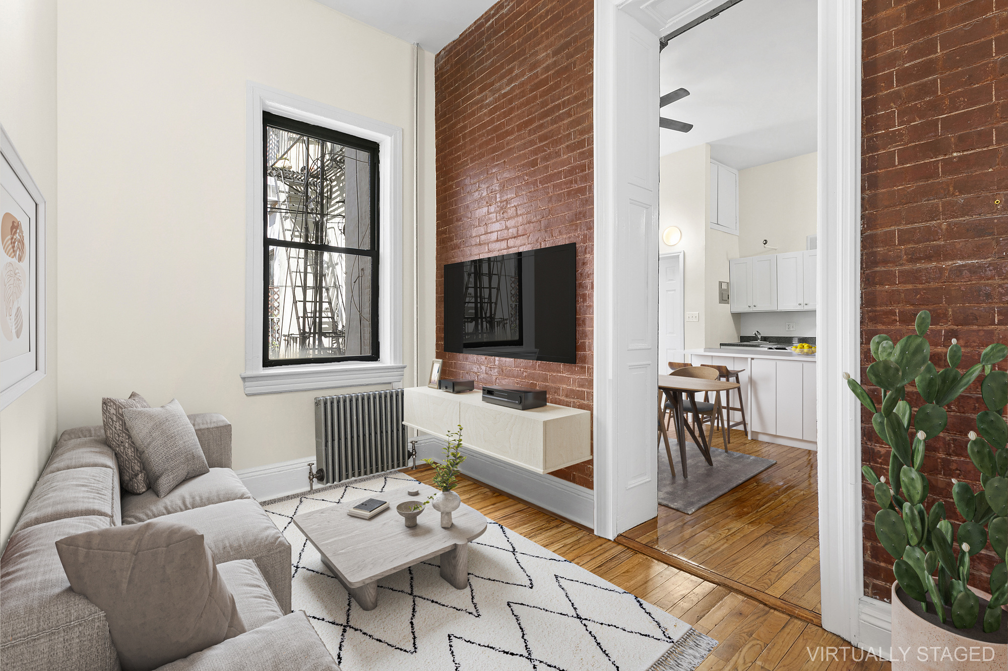 1100 Dean Street, Unit 4 Brooklyn, NY 11216 - Photo 5 of 13 a living room with furniture and a flat screen tv