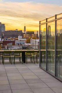a view of a terrace with furniture and stove