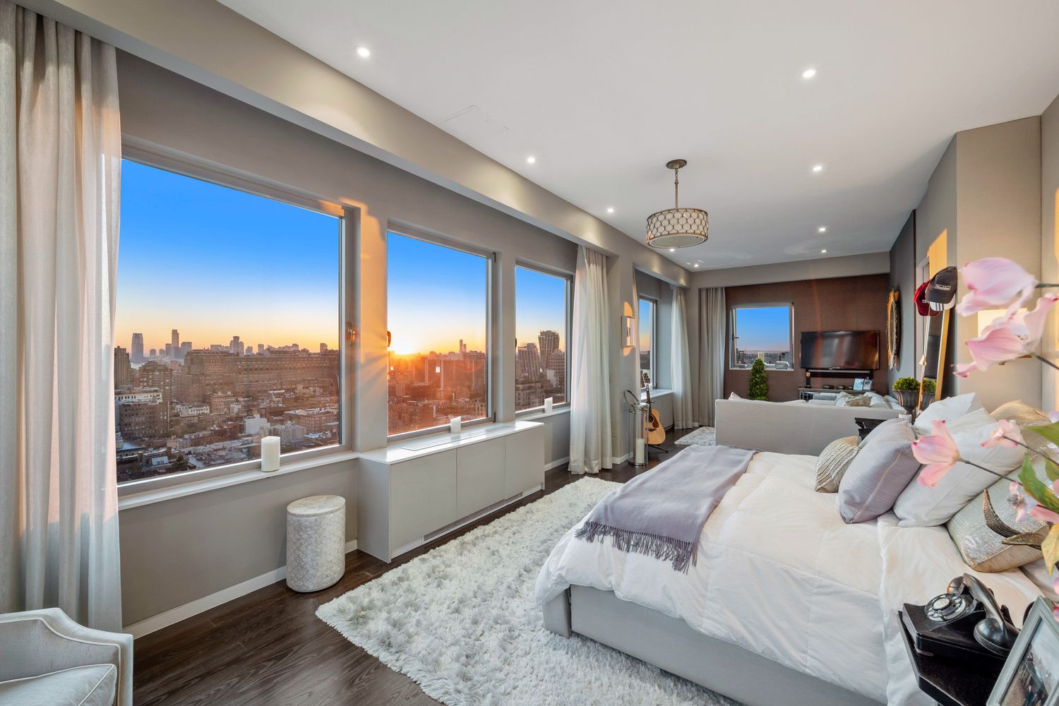 a bedroom with a large bed and a window