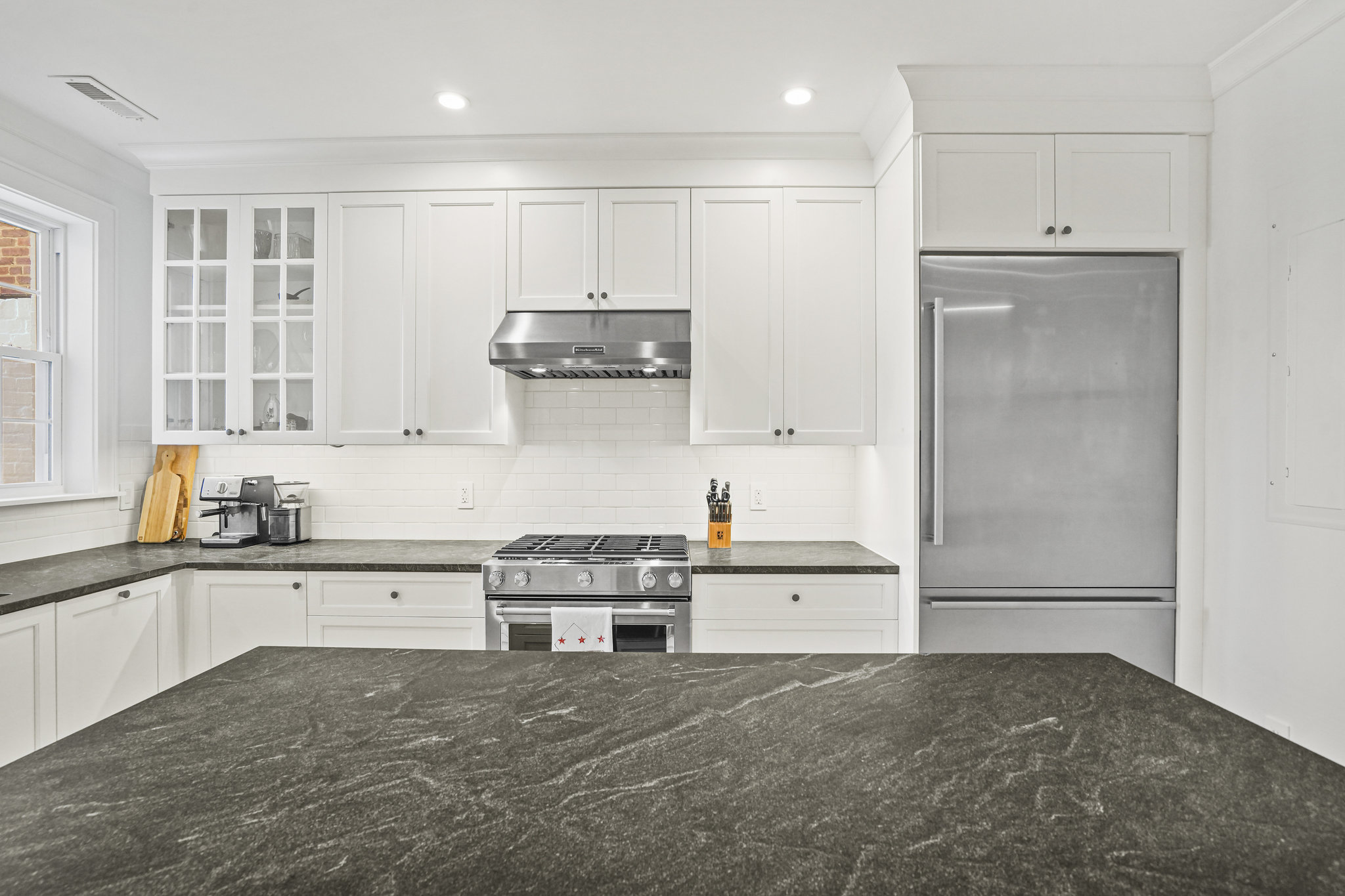 1920 35th Street Northwest Washington, DC 20007 - Photo 7 of 54 a kitchen with stainless steel appliances granite countertop a refrigerator and a stove top oven