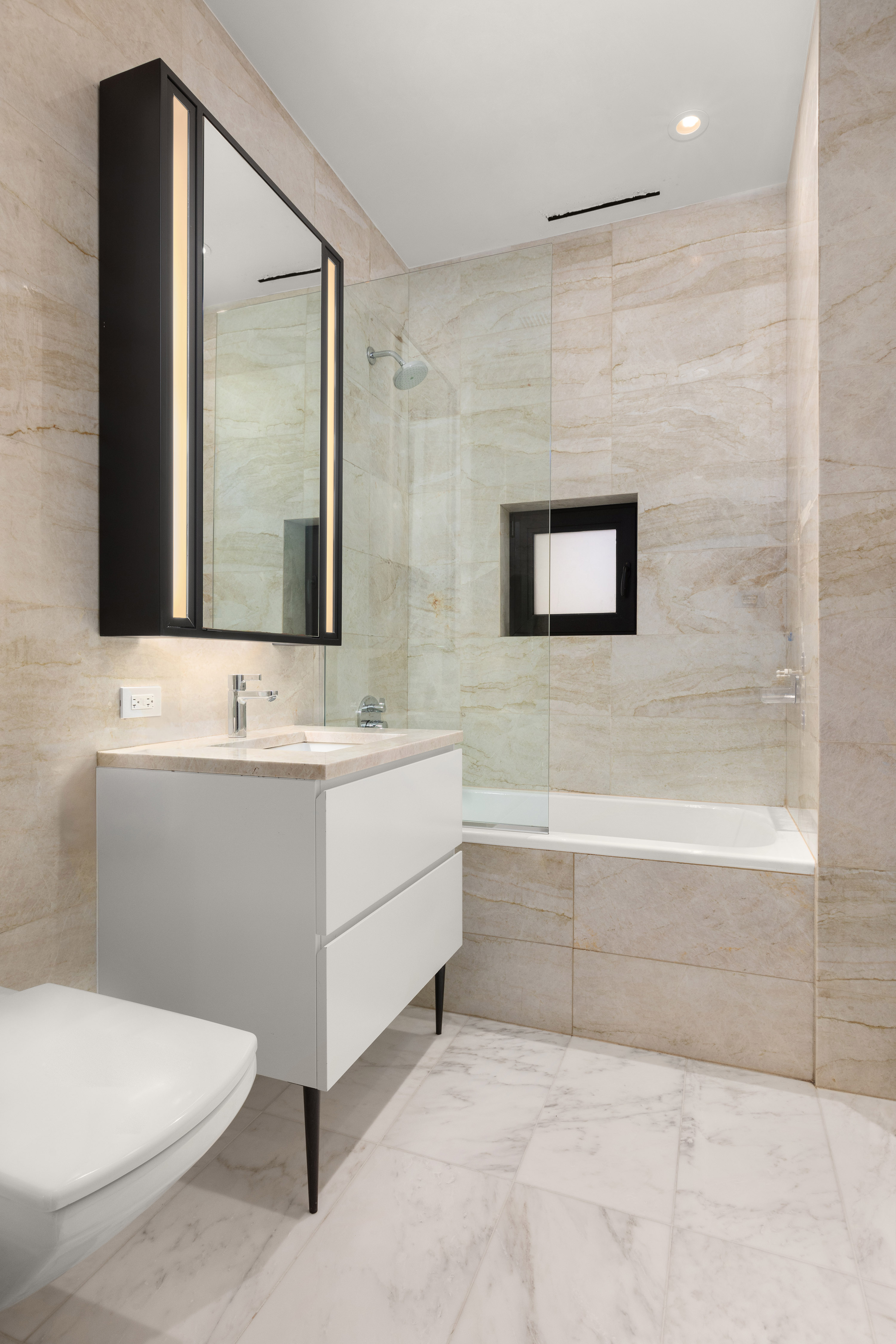 11 Beach Street, Unit THA Manhattan, NY 10013 - Photo 17 of 29 a bathroom with a sink a toilet and mirror