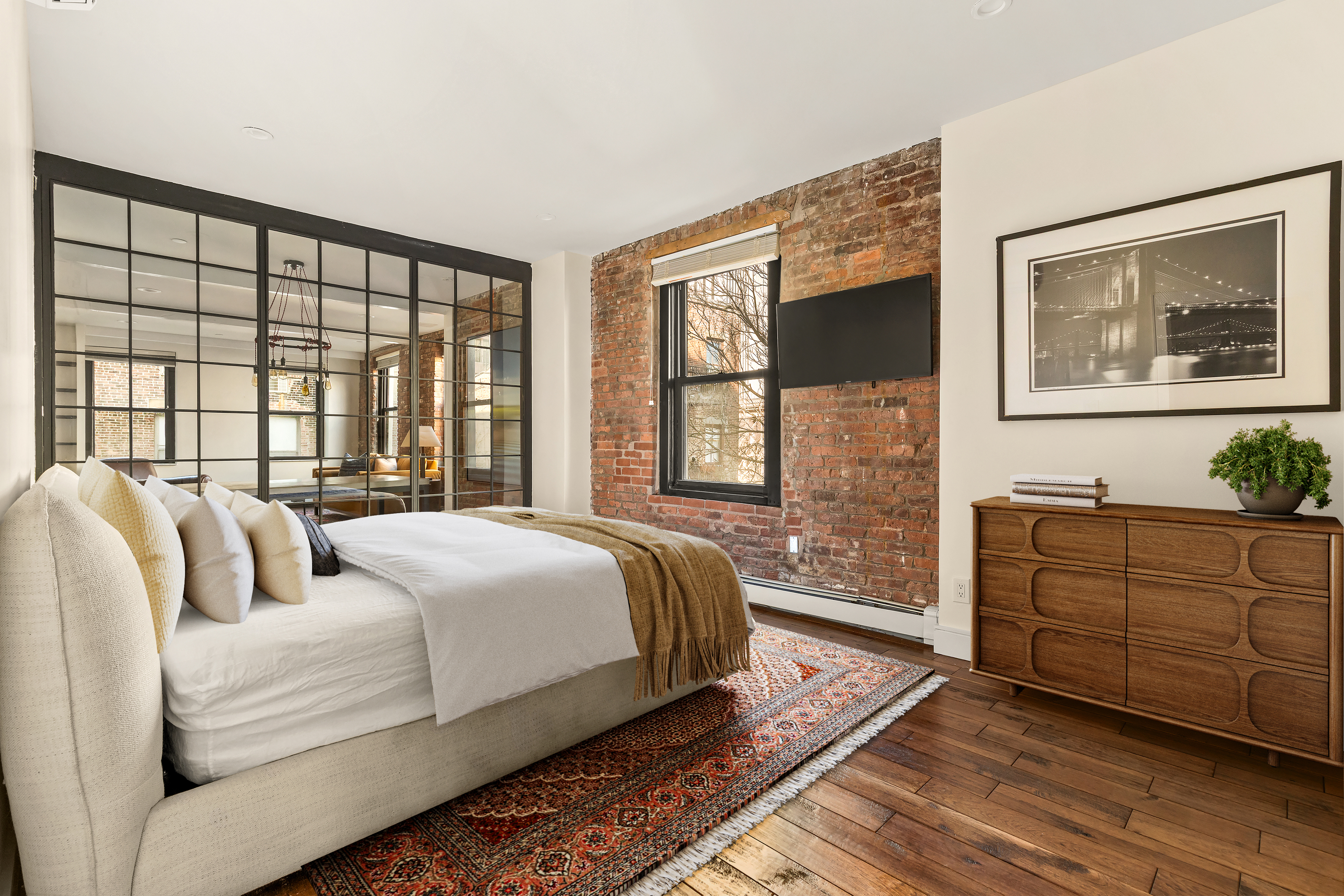 264 Water Street, Unit 6C Manhattan, NY 10038 - Photo 2 of 9 a bedroom with a bed and a large window