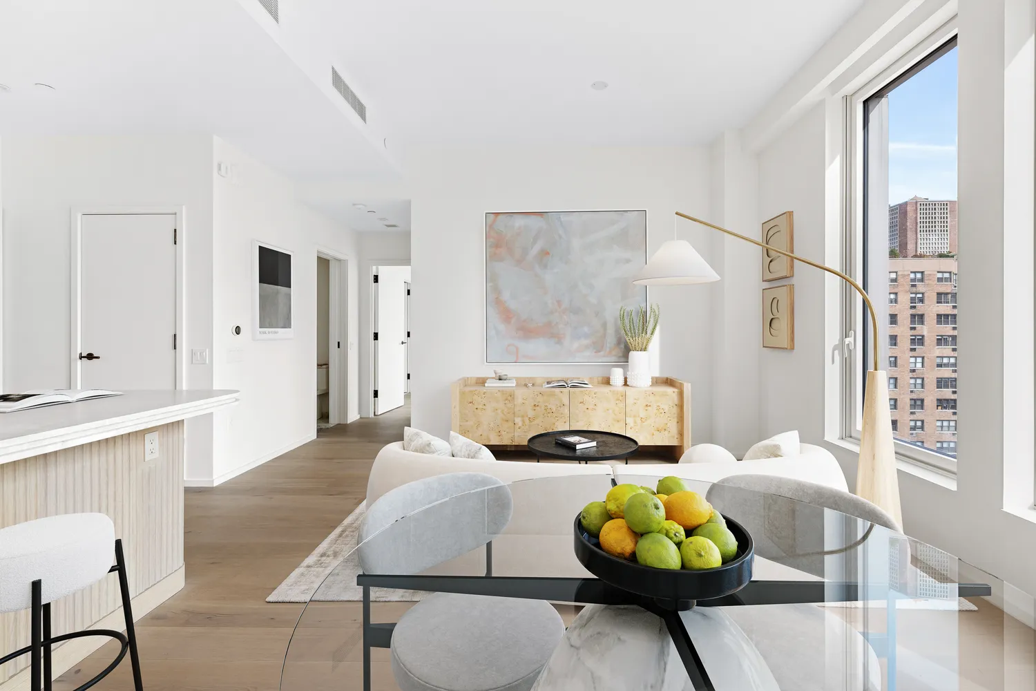 a living room with stainless steel appliances furniture and decor