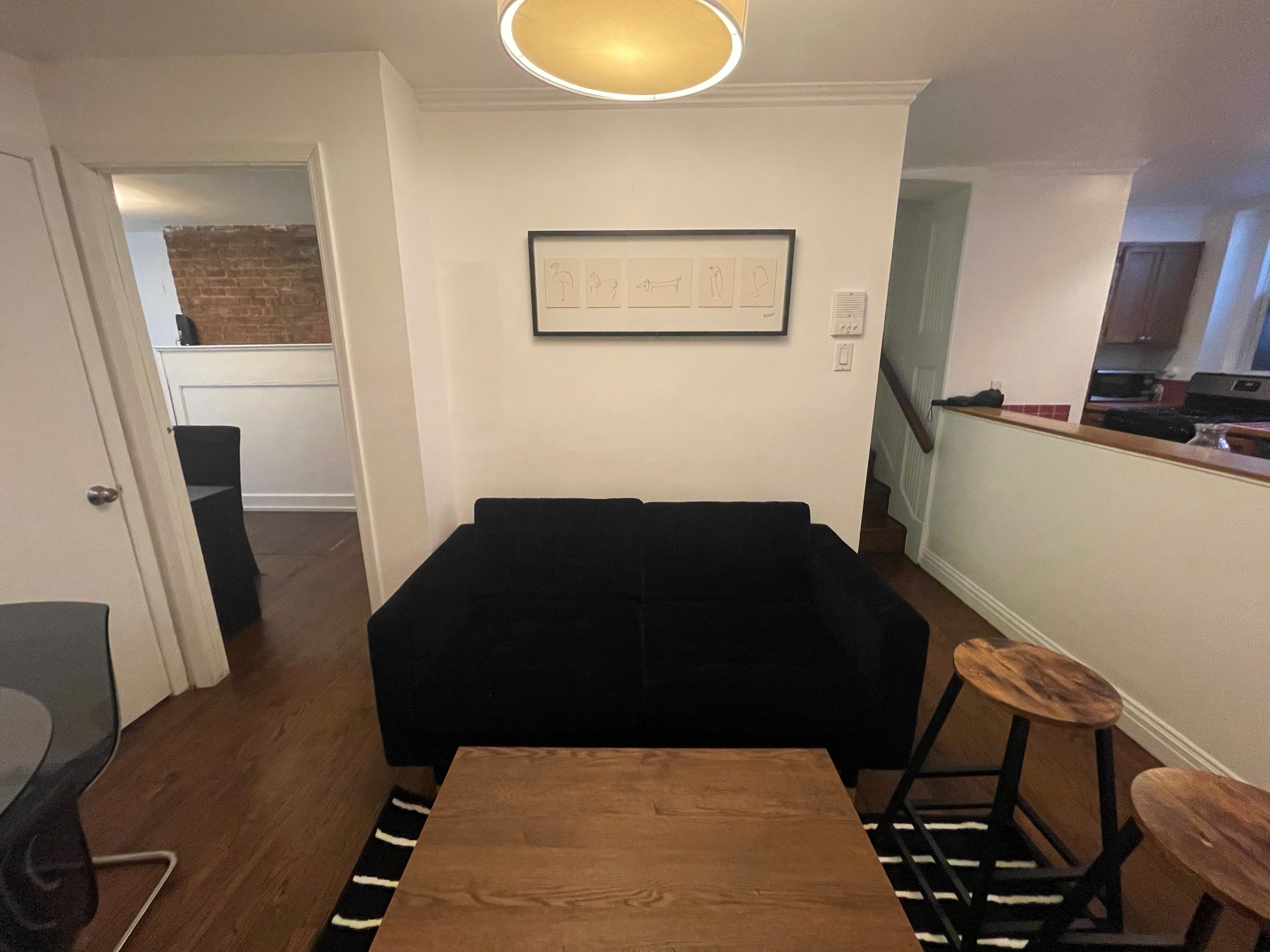120 East 10th Street, Unit 1 Manhattan, NY 10003 - Photo 14 of 24 a living room with furniture