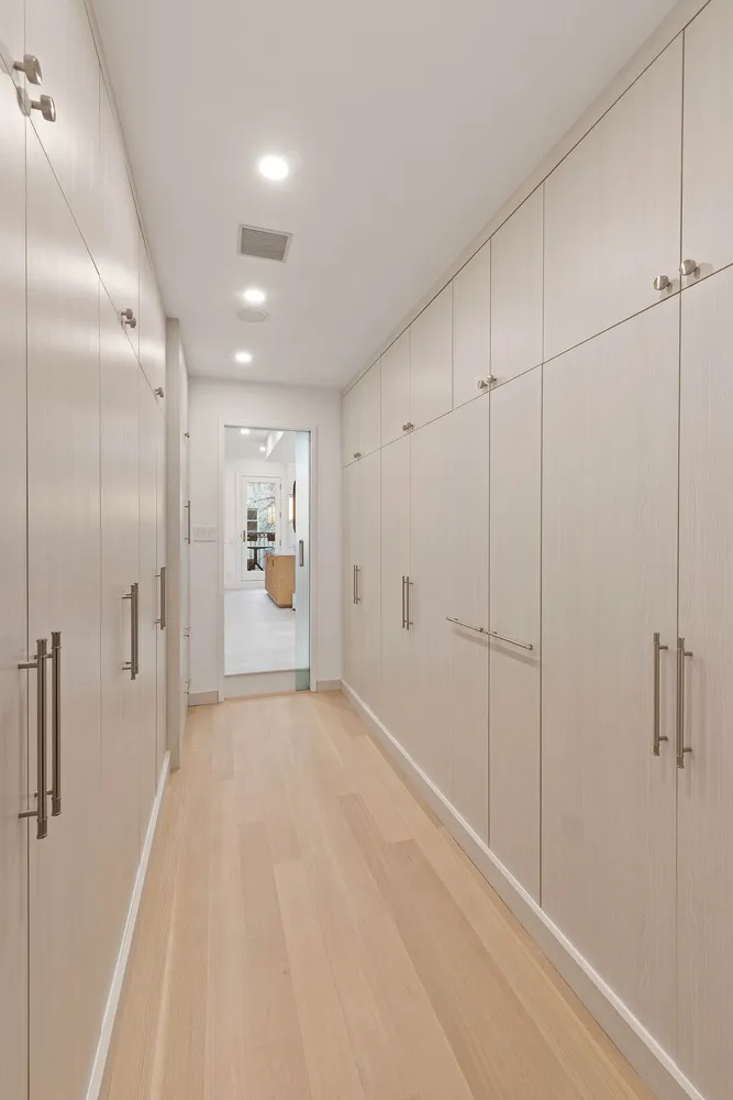 a view of a big room with closet and windows