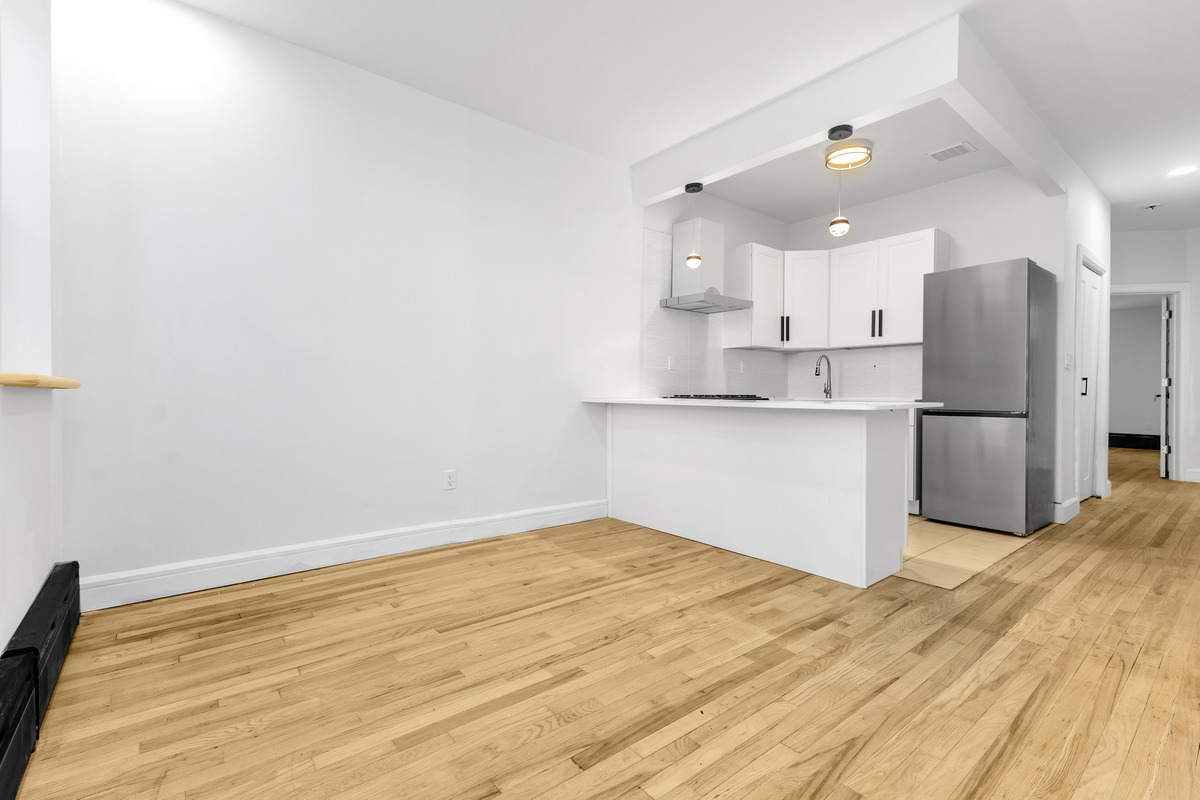 574 Gates Avenue Brooklyn, NY 11221 - Photo 10 of 16 a view of kitchen with wooden floor