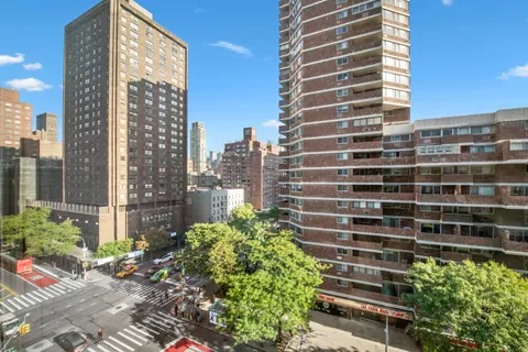 a view of a city with tall buildings