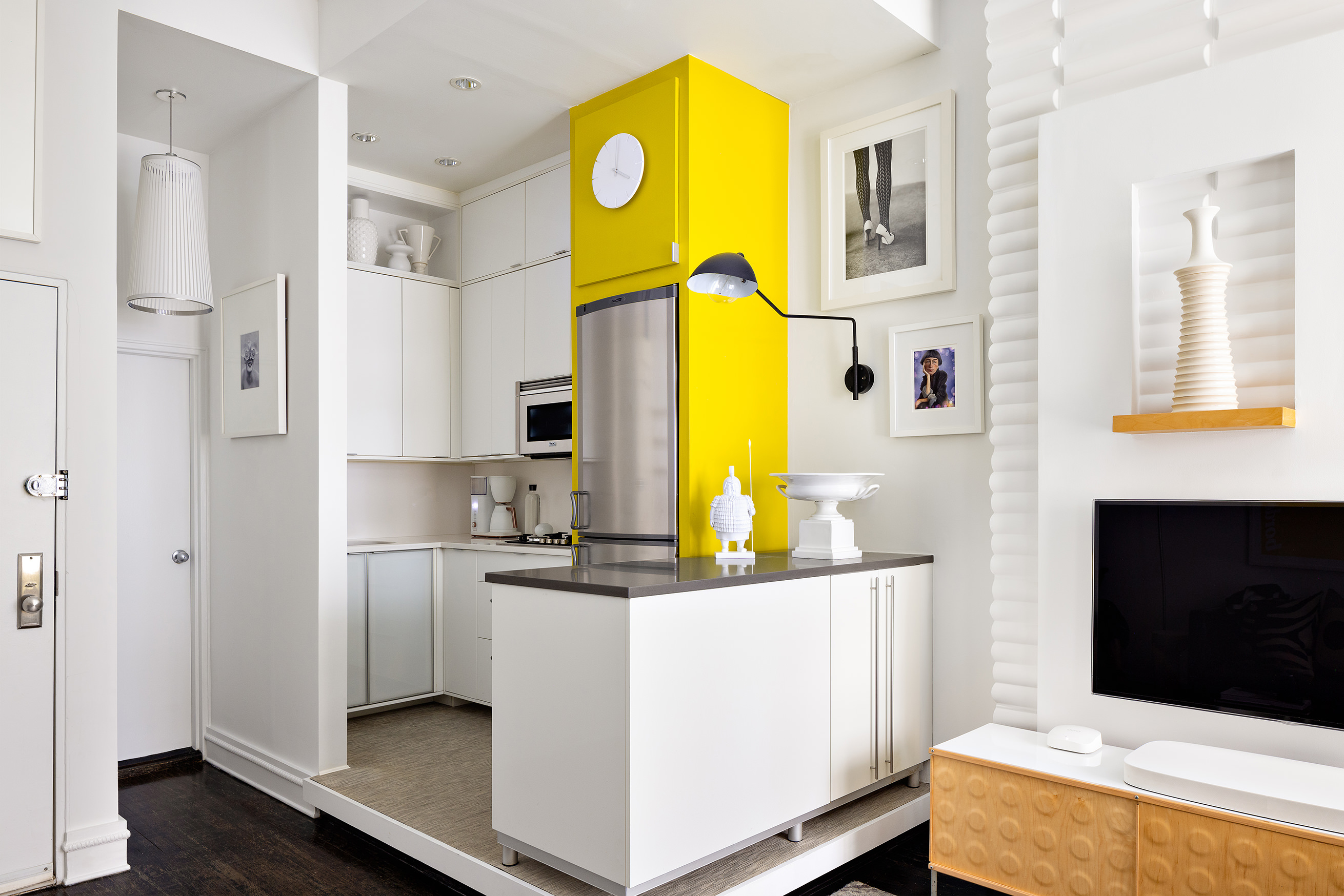 258 West 93rd Street, Unit 2B Manhattan, NY 10025 - Photo 3 of 9 a living room with a bed furniture and a flat screen tv