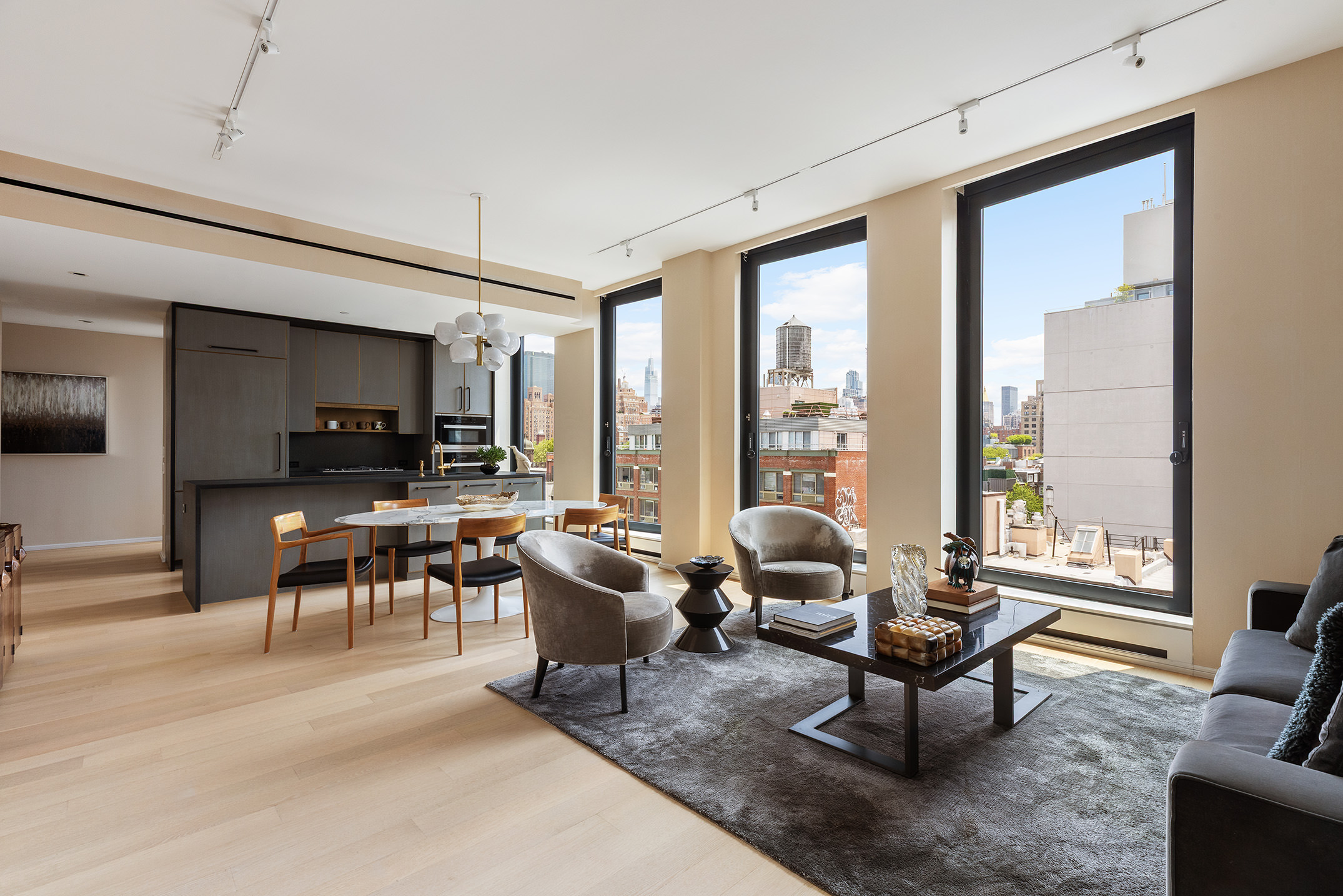 505 West 19th Street, Unit 7B Manhattan, NY 10011 - Photo 2 of 16 a living room with furniture and a large window