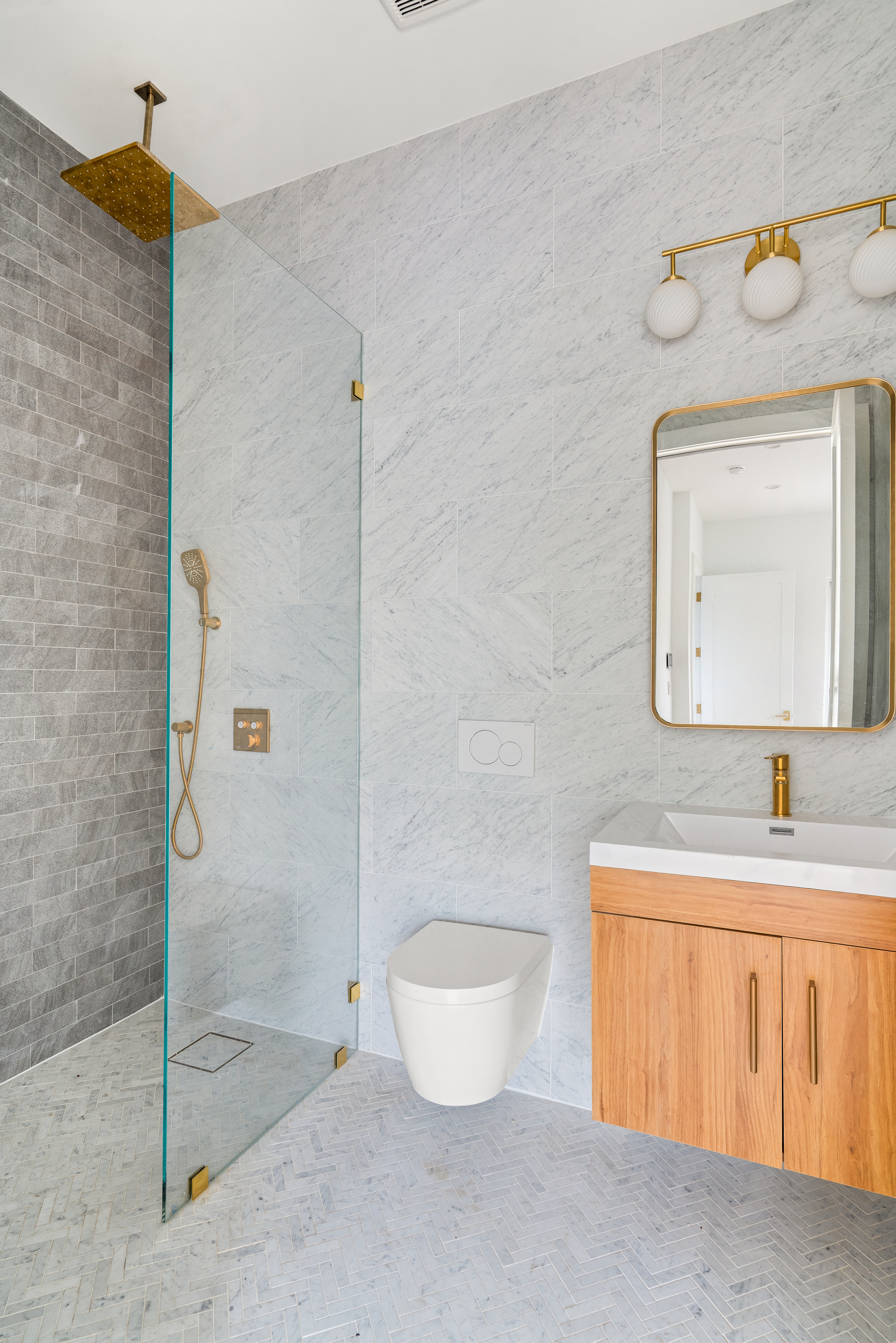 74 Carroll Street, Unit PH Brooklyn, NY 11231 - Photo 15 of 19 a bathroom with a granite countertop sink a toilet and a mirror