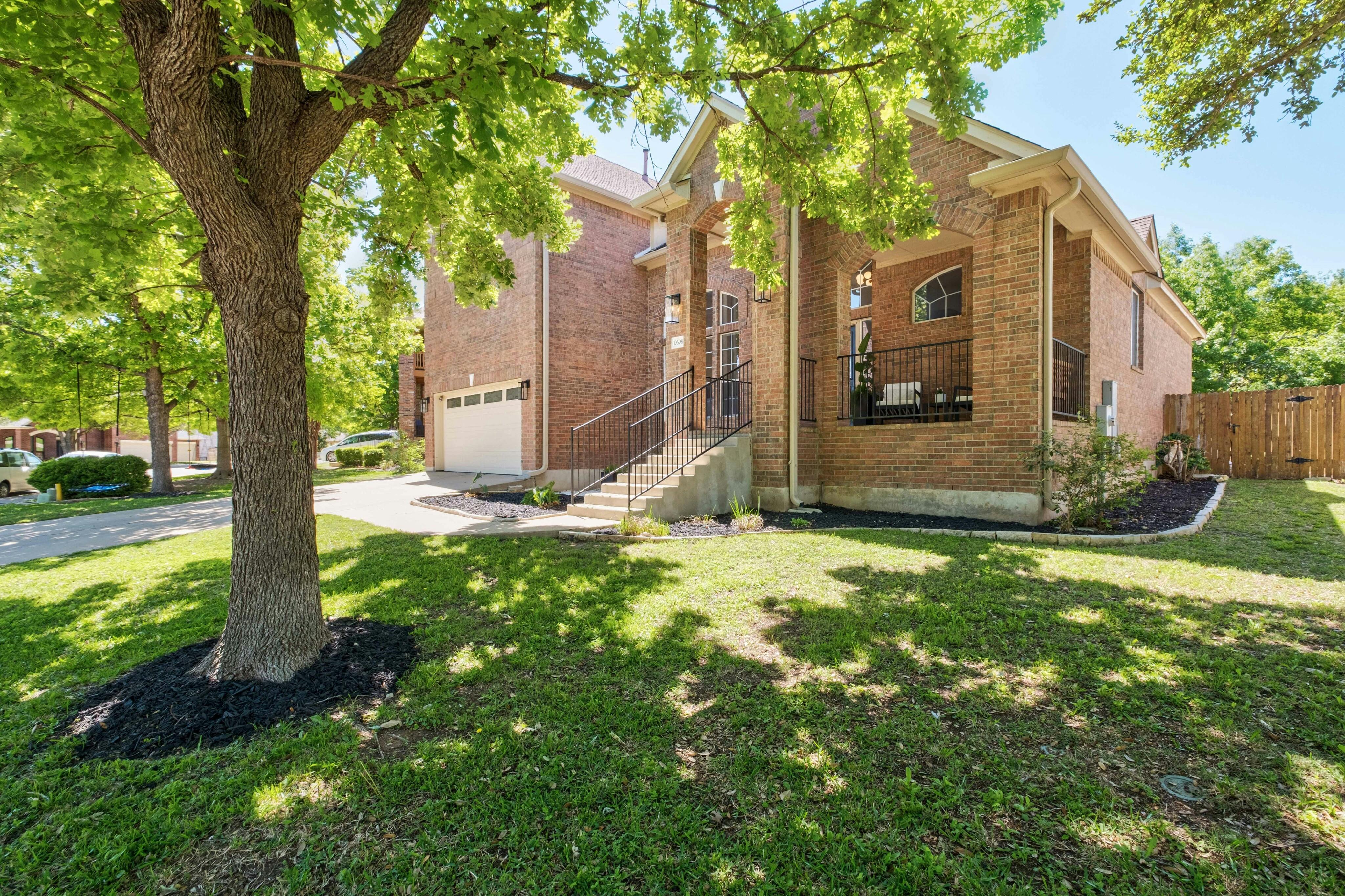 10608 Pointe View Drive Austin, TX 78738 - Photo 3 of 46 a view of a tree in front of a house