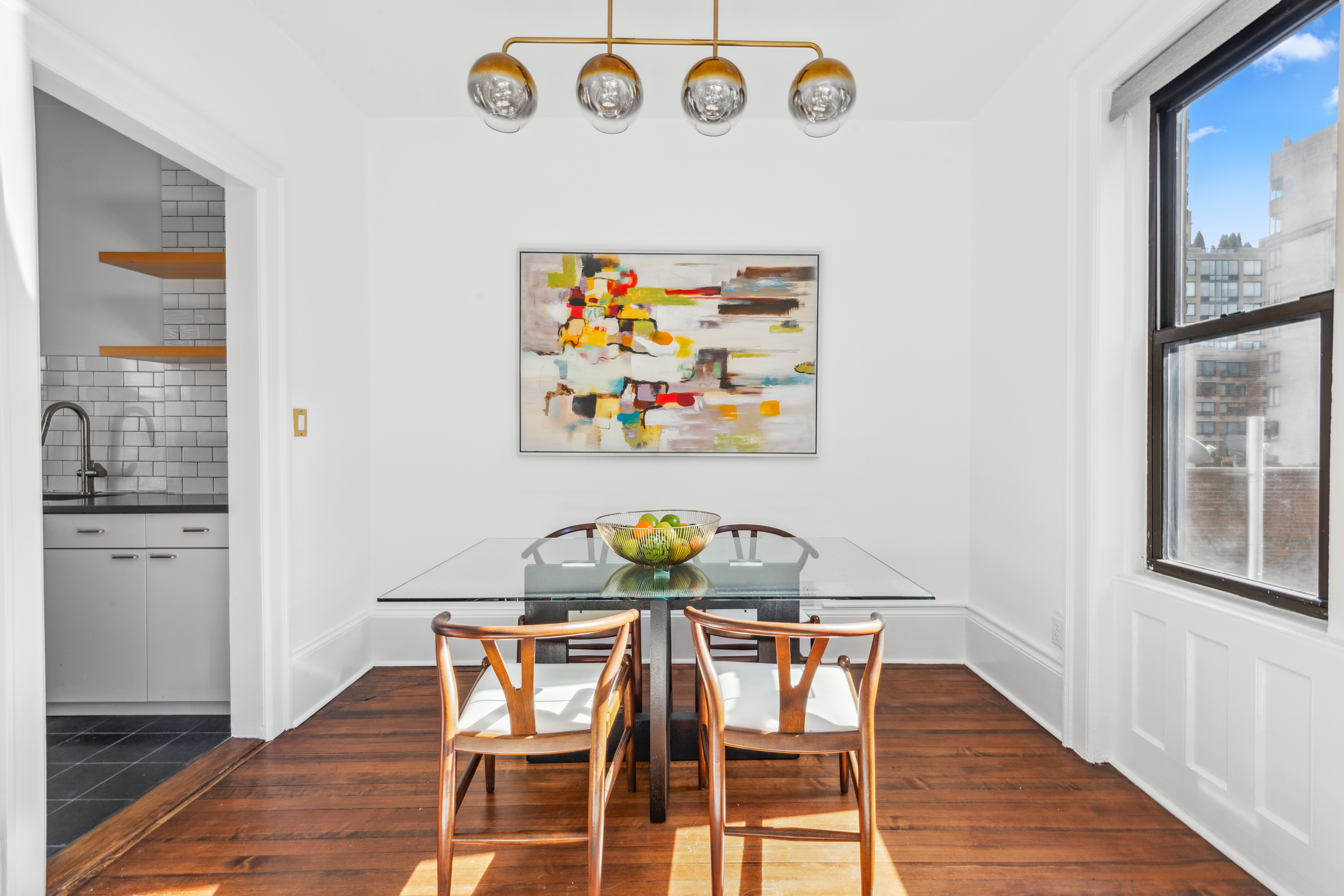 210 West 21st Street, Unit 6RE Manhattan, NY 10011 - Photo 4 of 13 a view of a dining room with furniture and wooden floor