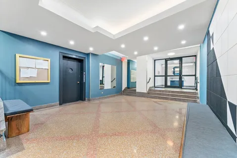 a view of an empty room with glass door