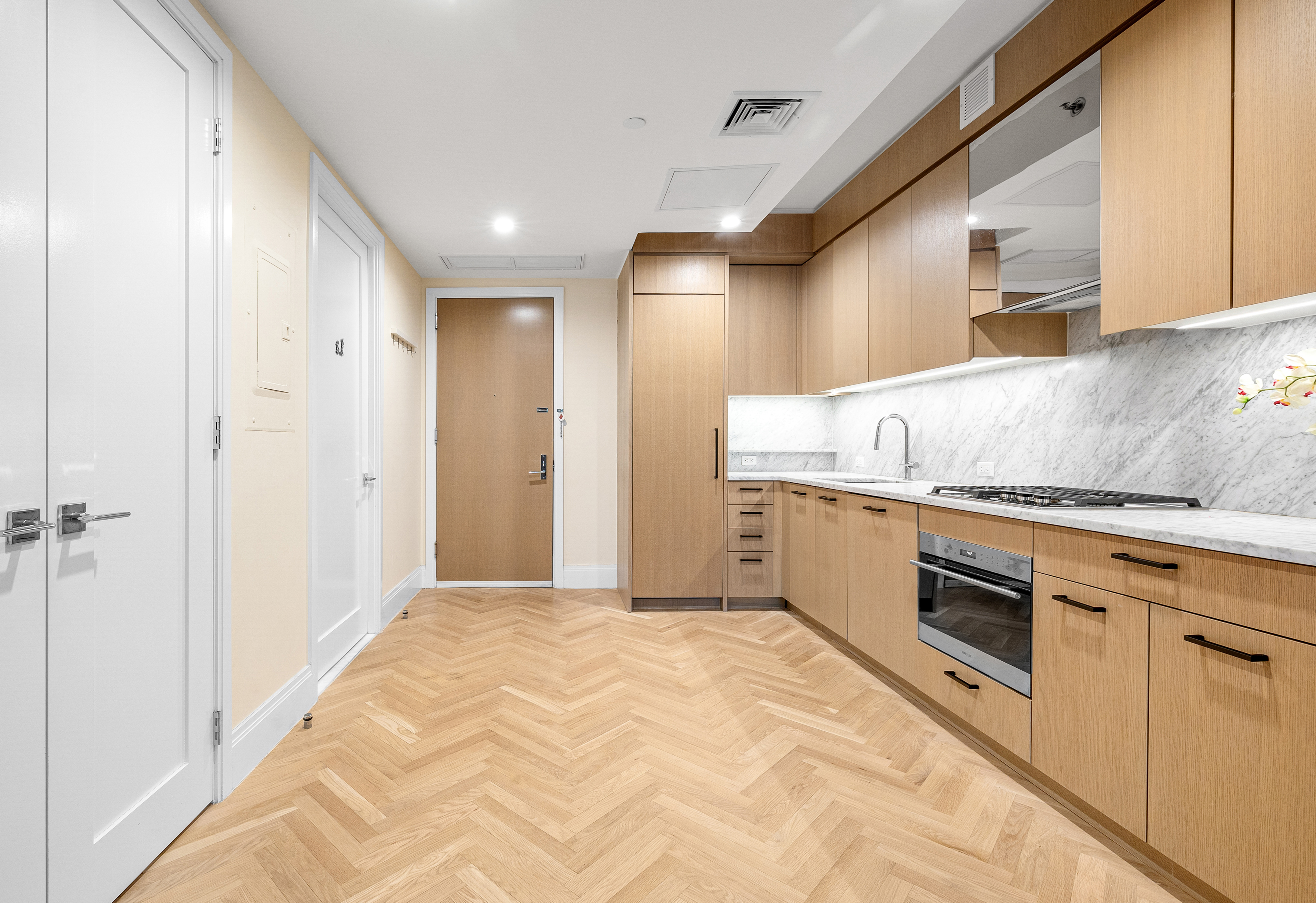300 West 122nd Street, Unit 4F Manhattan, NY 10027 - Photo 14 of 32 a kitchen with stainless steel appliances granite countertop a sink and cabinets