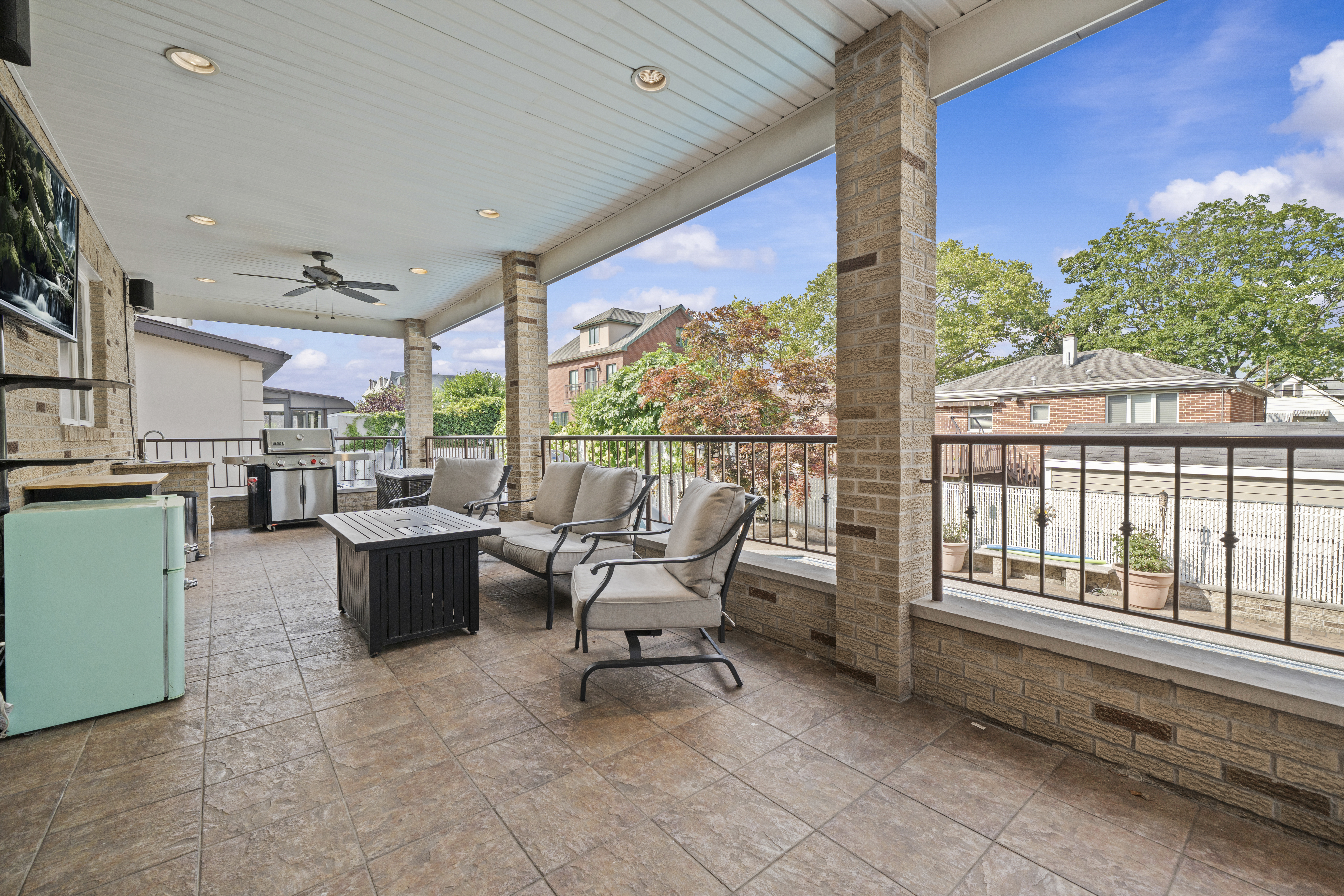 2253 East 64th Street Brooklyn, NY 11234 - Photo 35 of 45 a living room with furniture and a floor to ceiling window