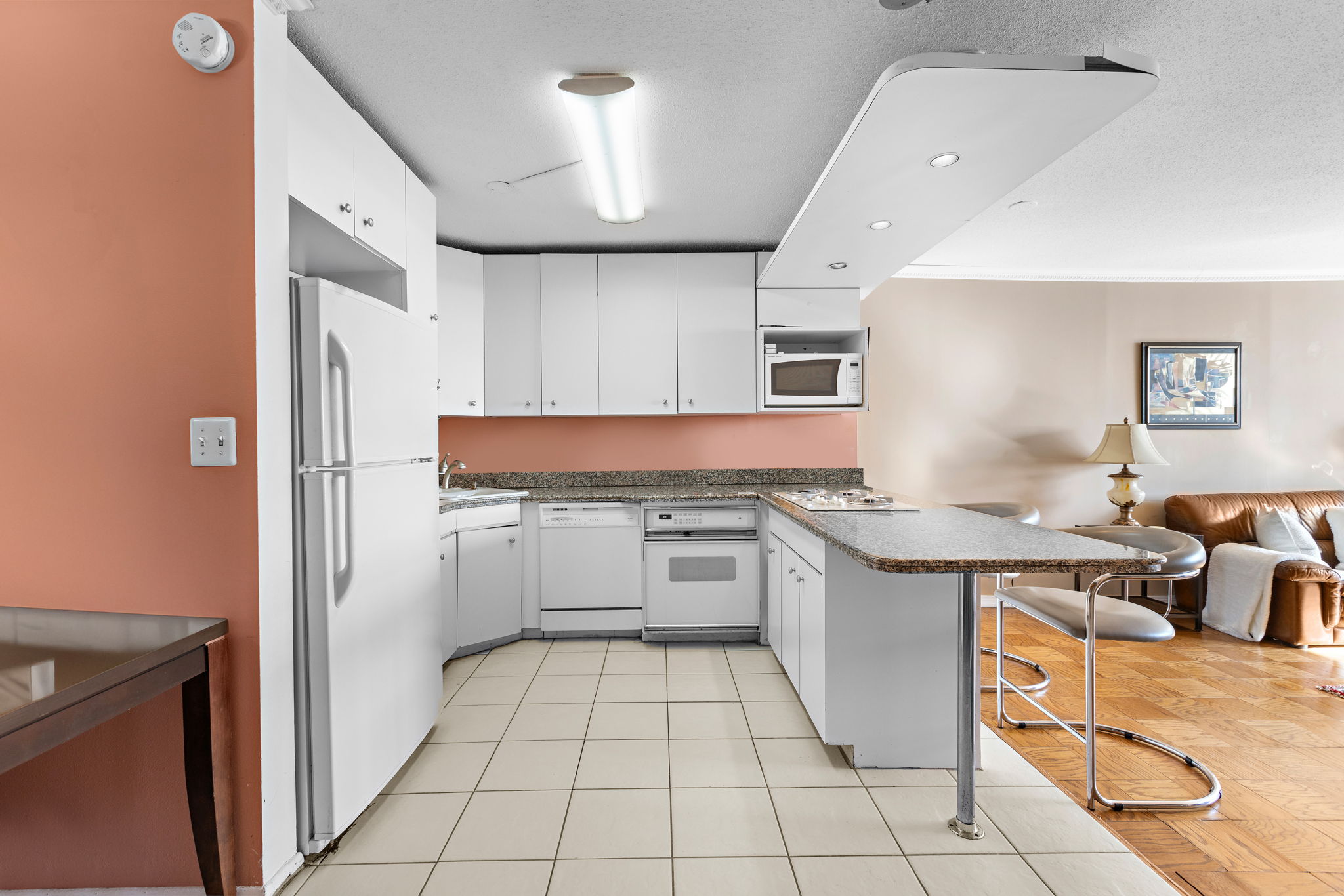 7004 JFK Boulevard East, Unit 40G Guttenberg, NJ 07093 - Photo 3 of 22 a kitchen with stainless steel appliances granite countertop a refrigerator and a stove top oven