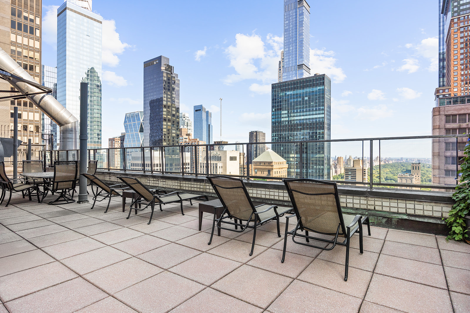 159 West 53rd Street, Unit 27H Manhattan, NY 10019 - Photo 11 of 15 a view of balcony with chairs and city view