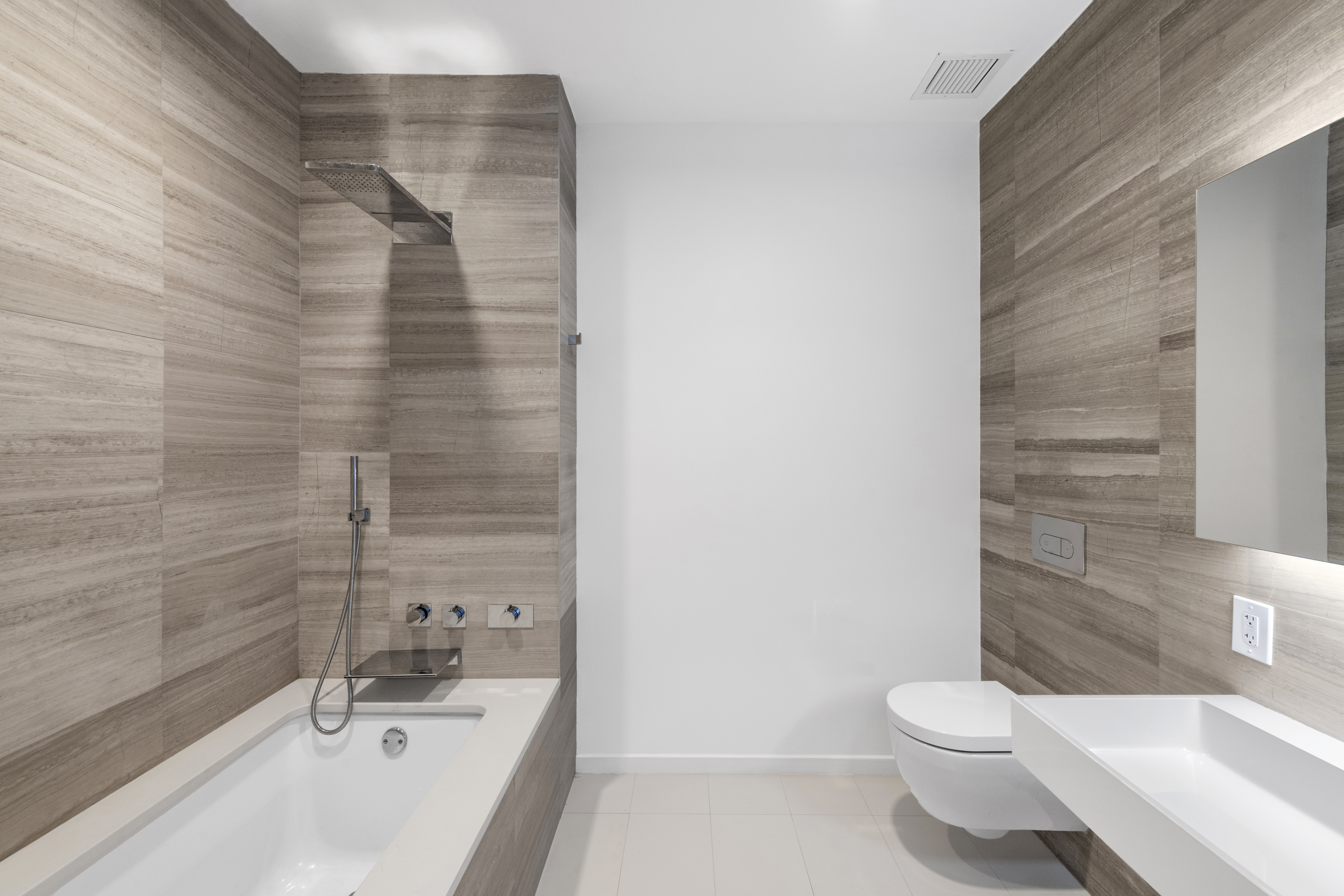 160 Imlay Street, Unit 3B3 Brooklyn, NY 11231 - Photo 8 of 16 a bathroom with a bathtub and shower
