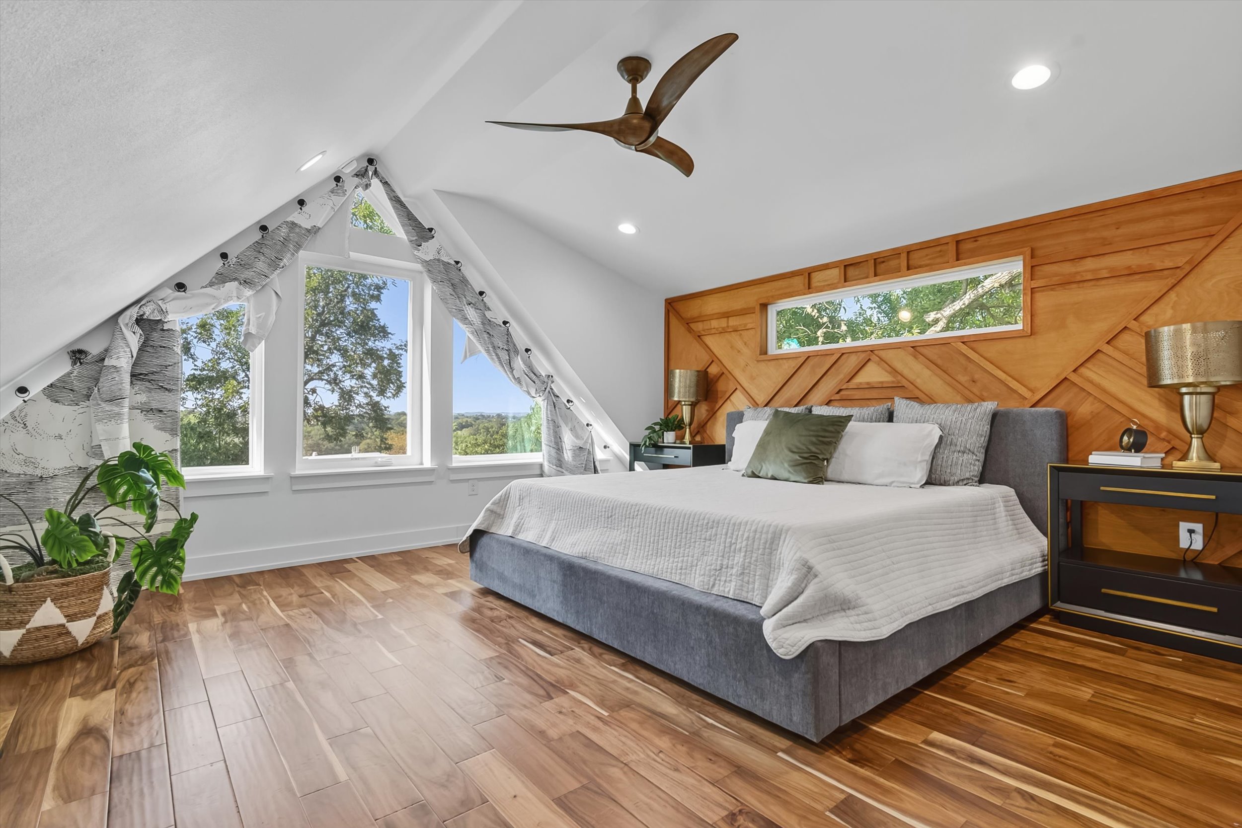 2712 Oak Springs Drive, Unit A Austin, TX 78702 - Photo 7 of 26 a bedroom with a large bed and a large window