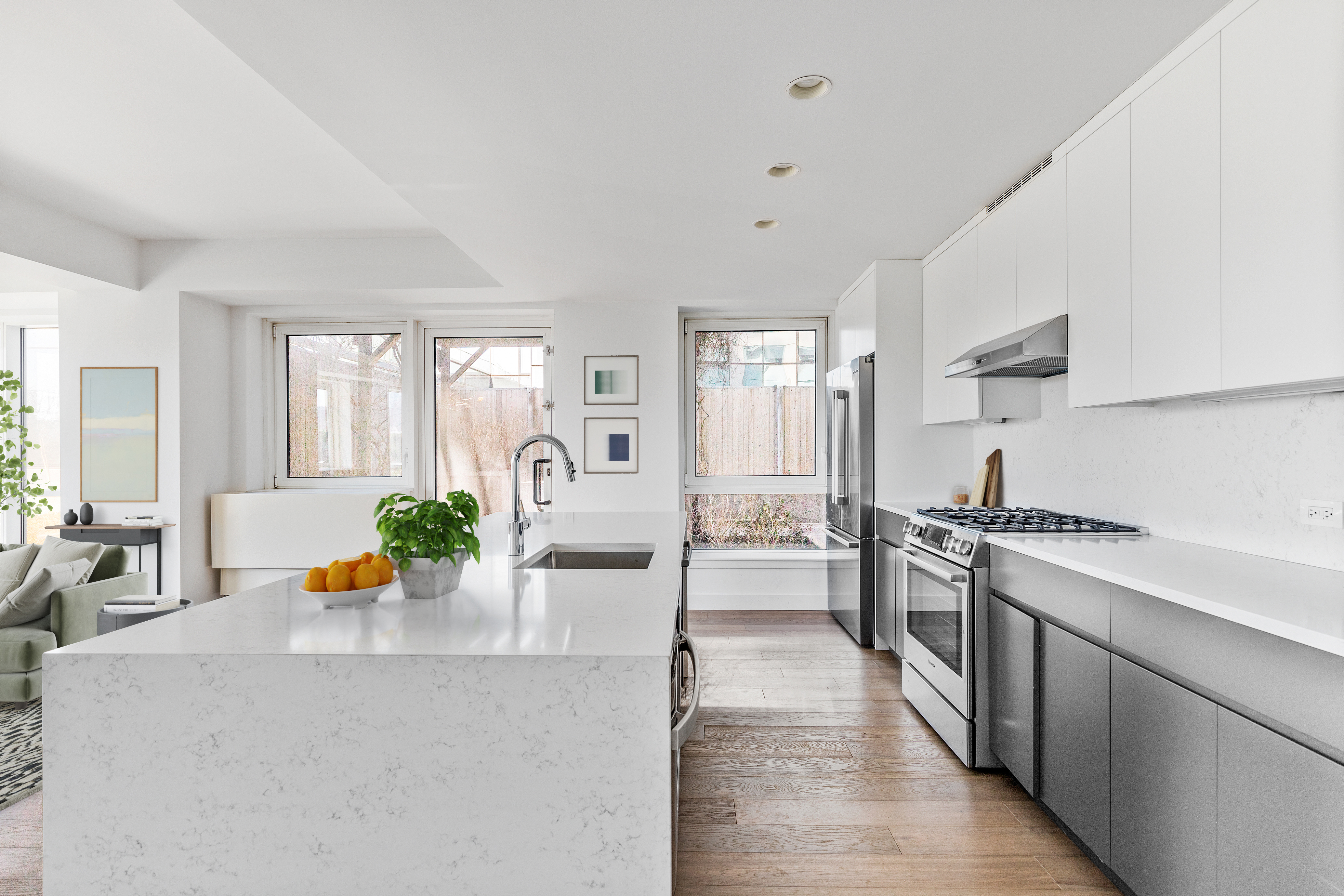 440 Kent Avenue, Unit 1B Brooklyn, NY 11249 - Photo 4 of 22 a kitchen with stainless steel appliances granite countertop a stove a sink and a refrigerator