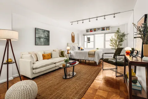 a living room with furniture and a rug