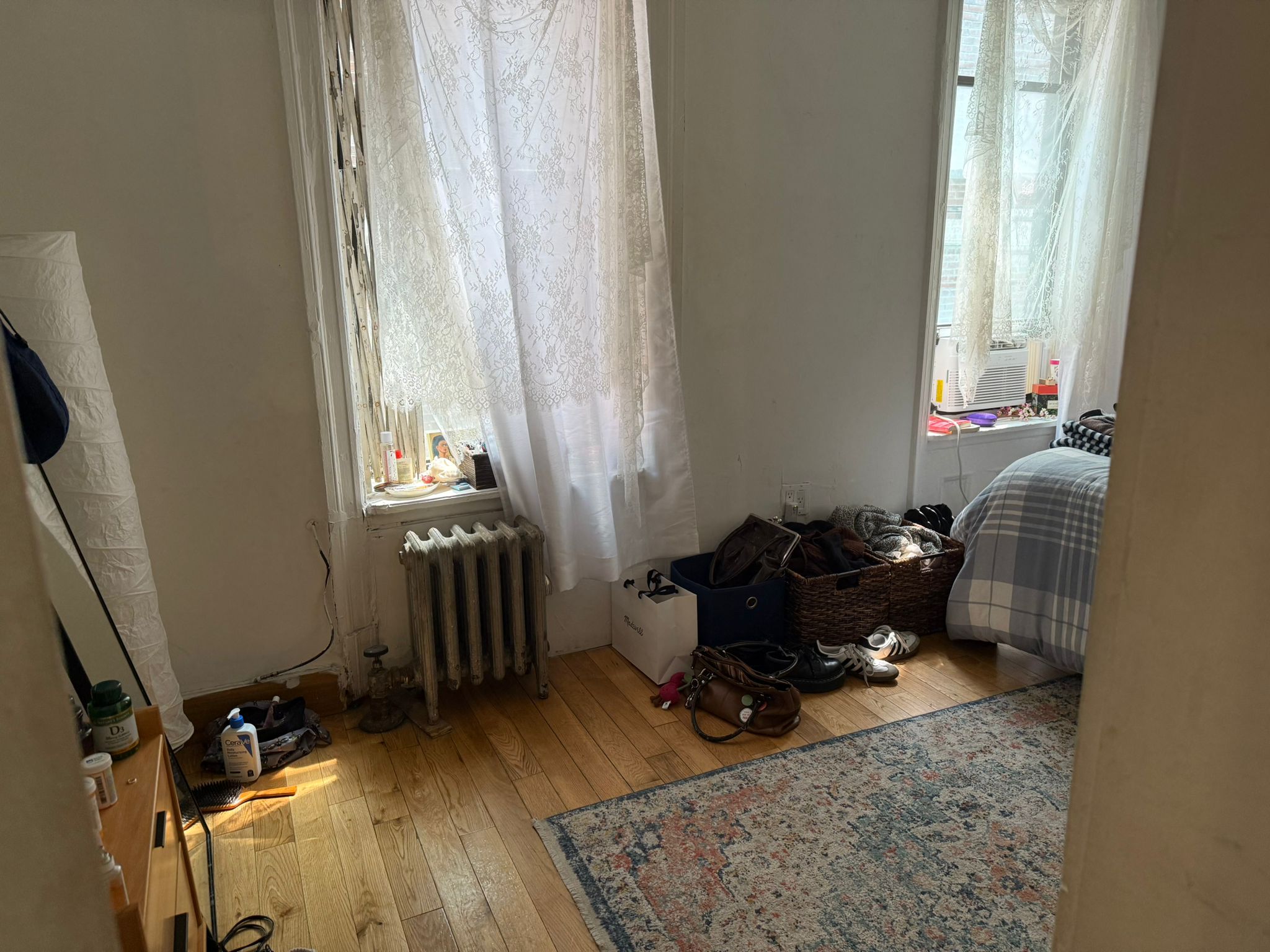 1278 1st Avenue, Unit 2 Manhattan, NY 10065 - Photo 1 of 19 a room with furniture equipment and a window