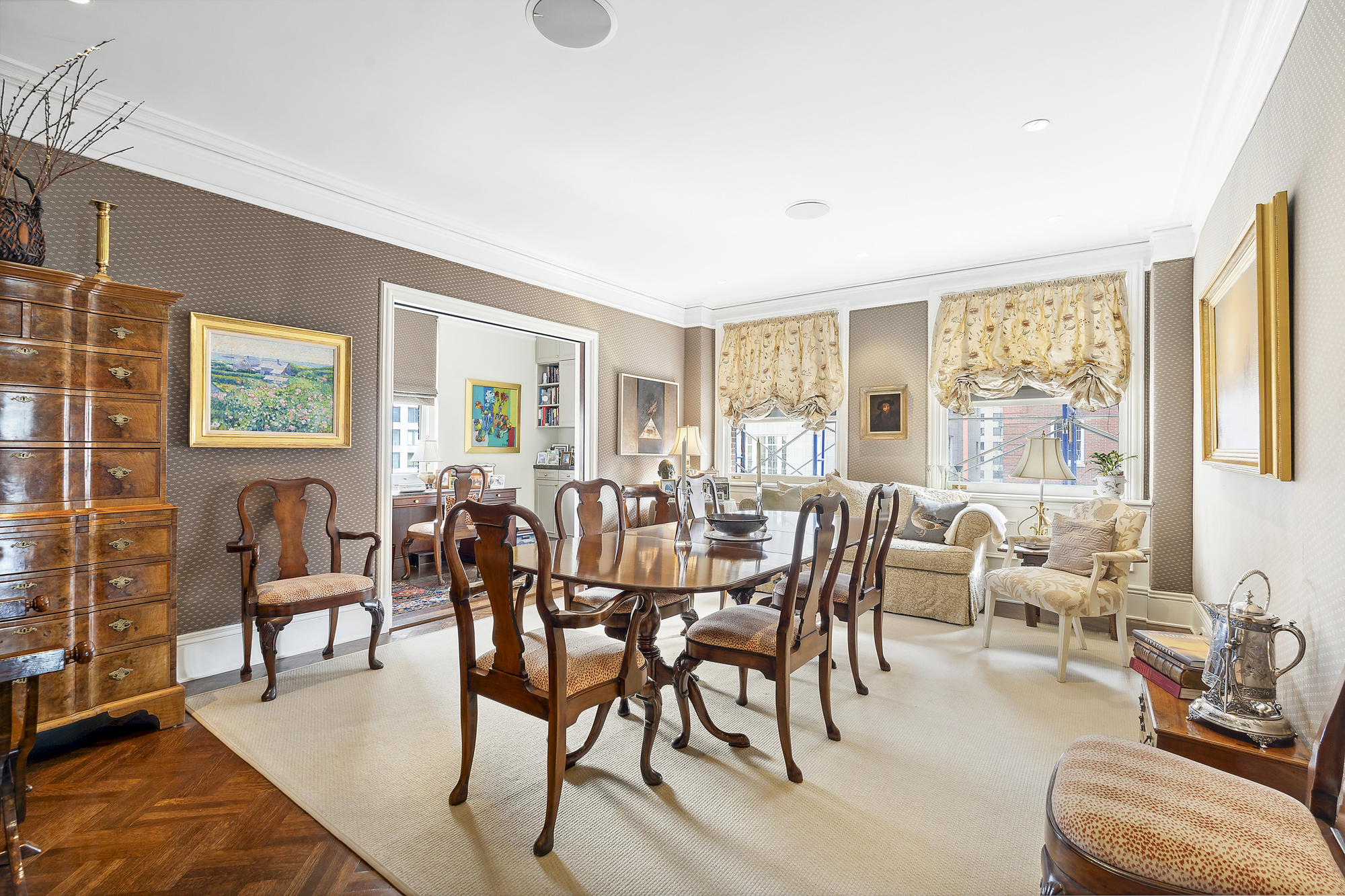 31 East 79th Street, Unit 10E Manhattan, NY 10075 - Photo 2 of 11 a view of a dining room with furniture a rug and wooden floor