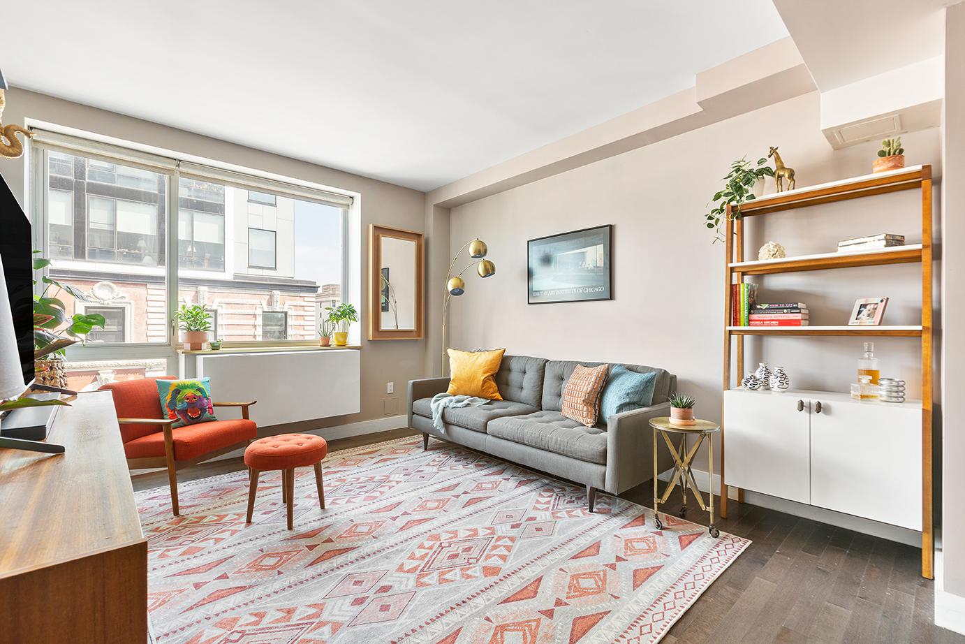 88 Morningside Avenue, Unit 8E Manhattan, NY 10027 - Photo 2 of 7 a living room with furniture a rug and a large window
