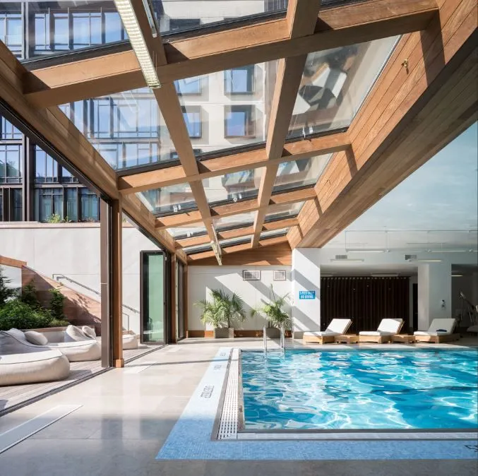 a view of swimming pool with a outdoor seating