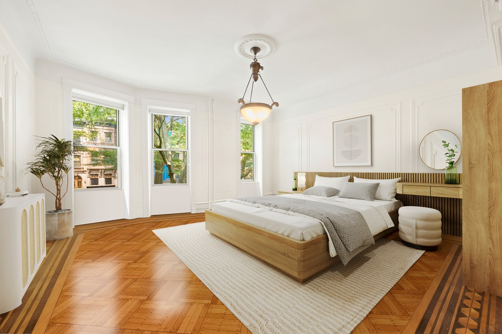 524 3rd Street Brooklyn, NY 11215 - Photo 9 of 18 a spacious bedroom with a bed and a chandelier