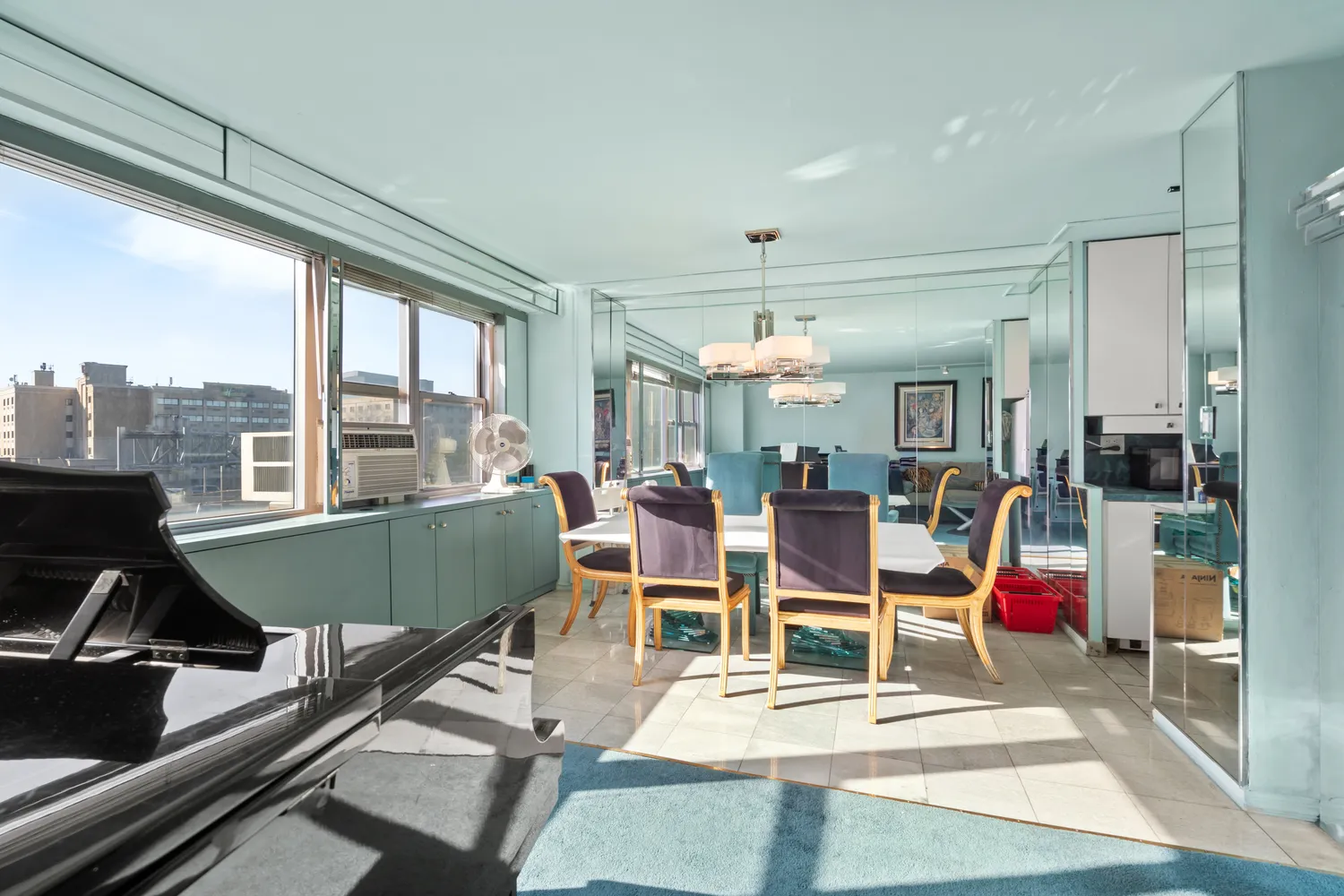 a living room with furniture a table and chairs