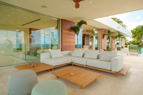 a kitchen with kitchen island a stove a sink and a refrigerator