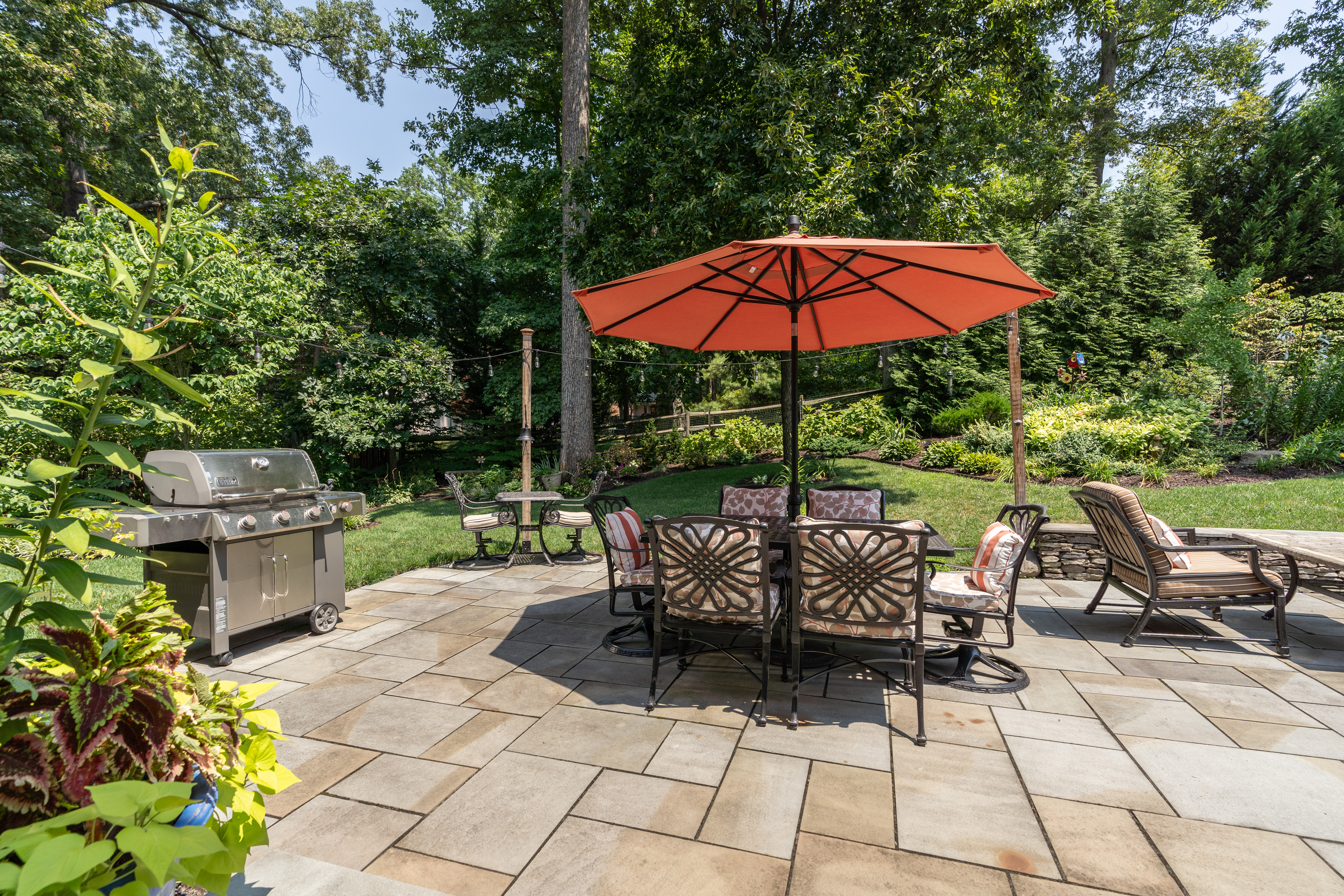7303 Fort Hunt Road Alexandria, VA 22307 - Photo 7 of 11 a view of a patio with a table and chairs under an umbrella