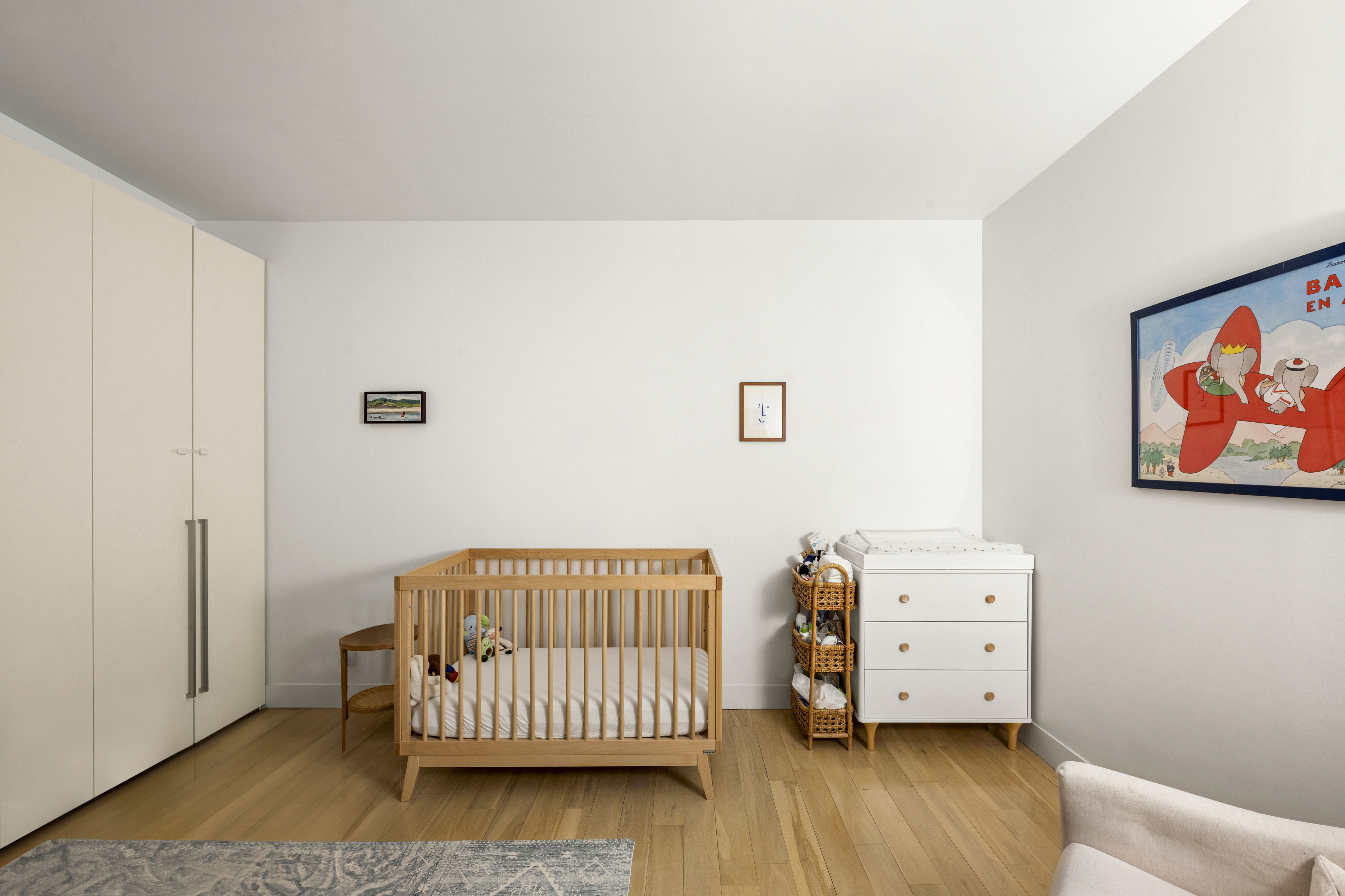 111 Fulton Street, Unit 308 Manhattan, NY 10038 - Photo 6 of 13 a bedroom with a bed and wooden floor