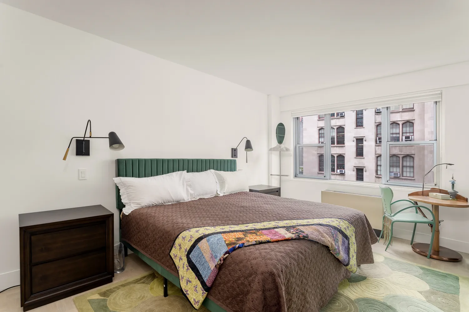 a bedroom with a bed and a cabinets