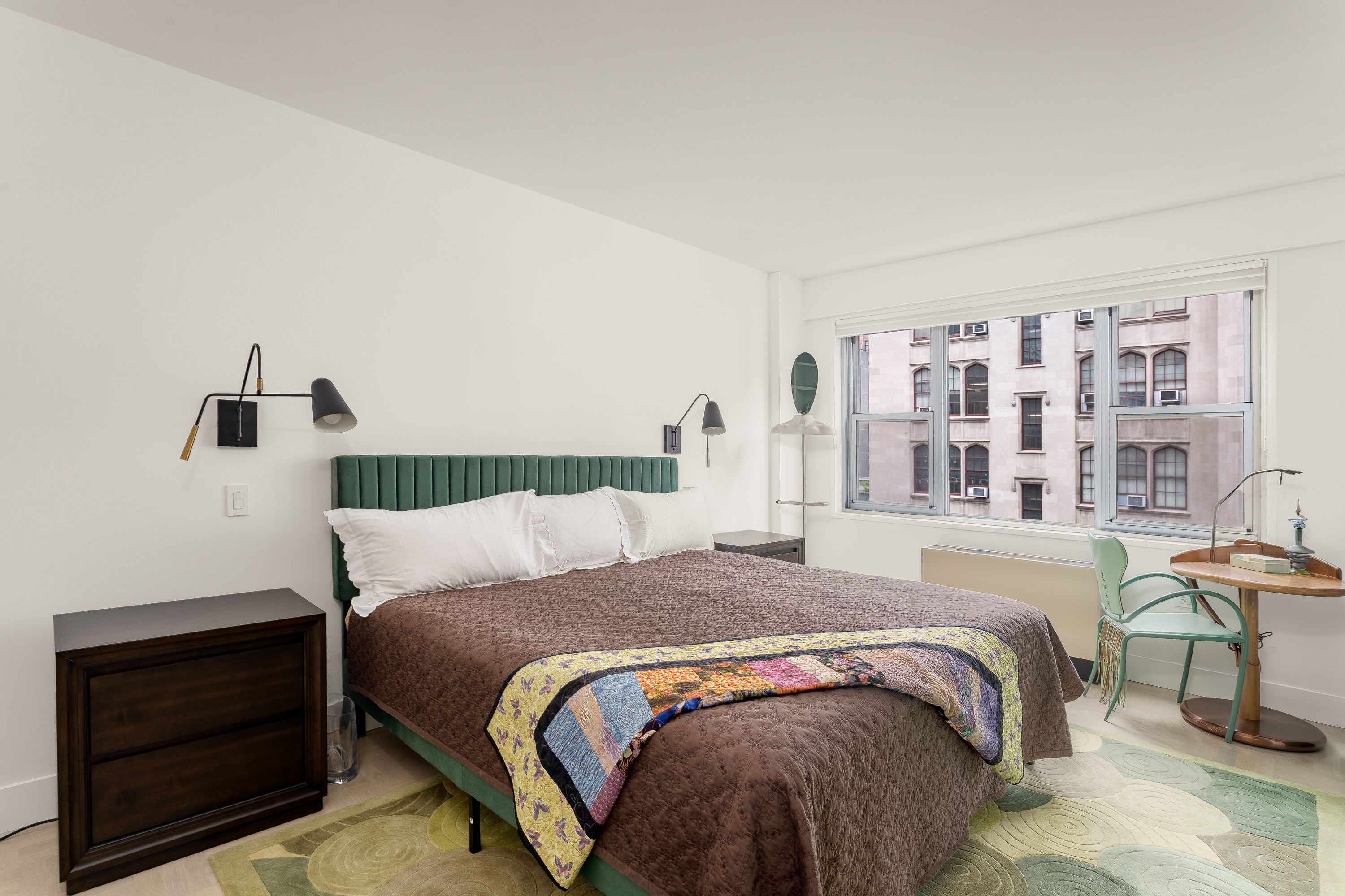 150 East 69th Street, Unit 5C Manhattan, NY 10021 - Photo 12 of 15 a bedroom with a bed and a cabinets