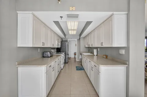 a spacious bathroom with a double vanity sink mirror and